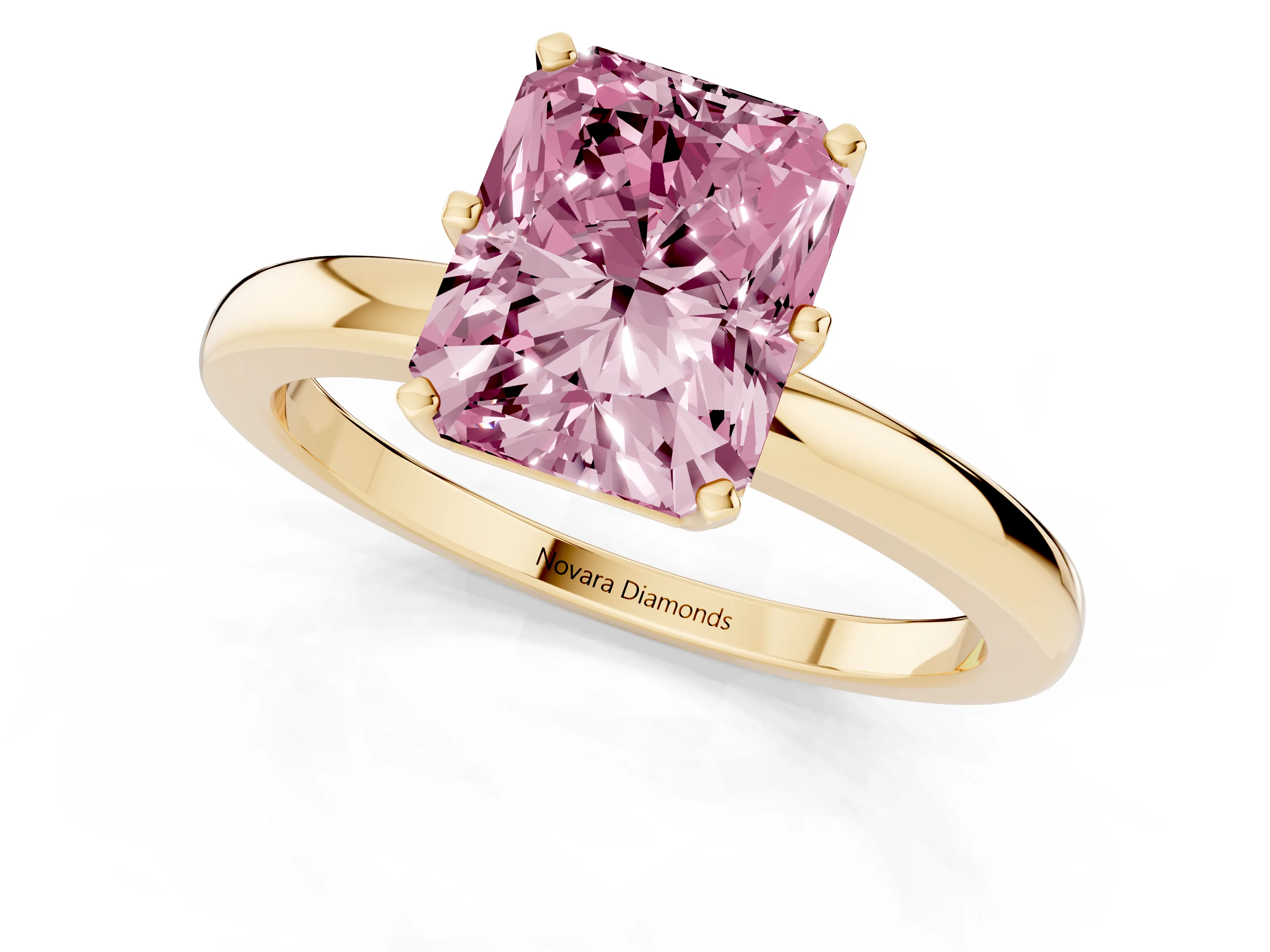 Fancy Pink Radiant Cut Diamond Solitaire Ring Set in Yellow gold with Raised Prong Setting on a Classic Band