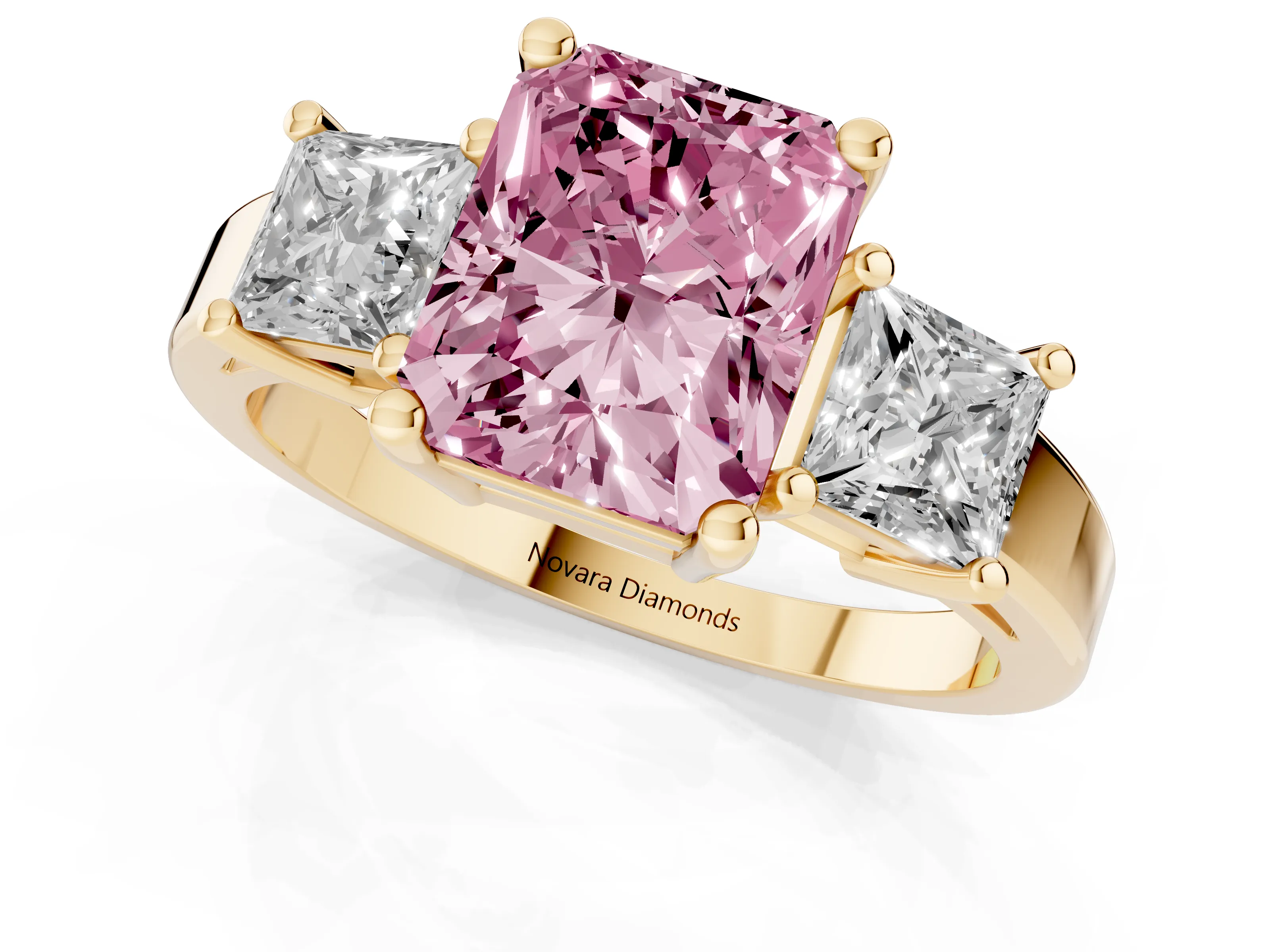 Fancy Pink Three-Stone Radiant Cut Diamond Solitaire Ring Set in Yellow gold with Prong Setting
