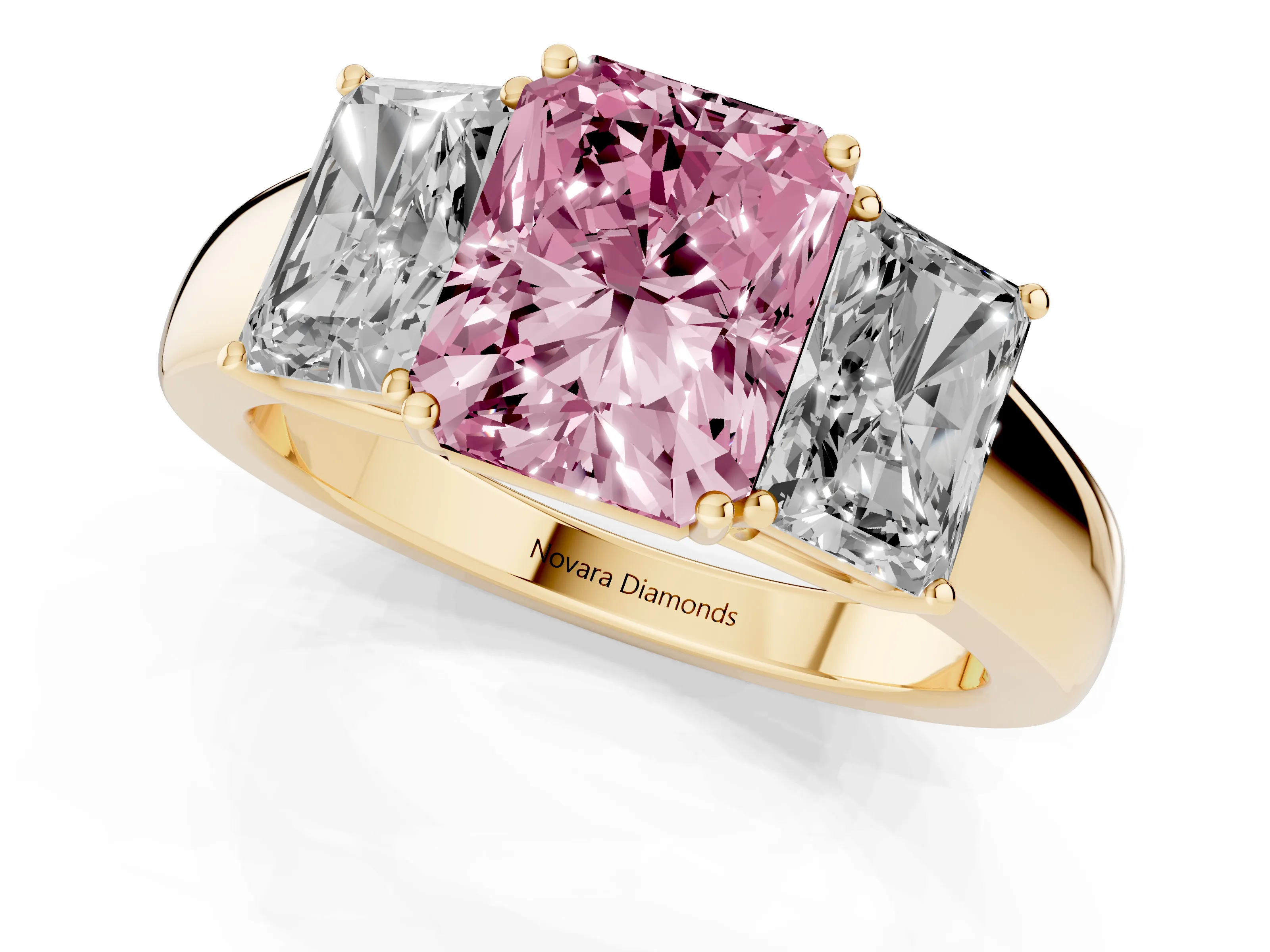 Fancy Pink Three-Stone Radiant Cut Diamond Ring Set in Yellow gold with Matching Prong Settings and Plain Band