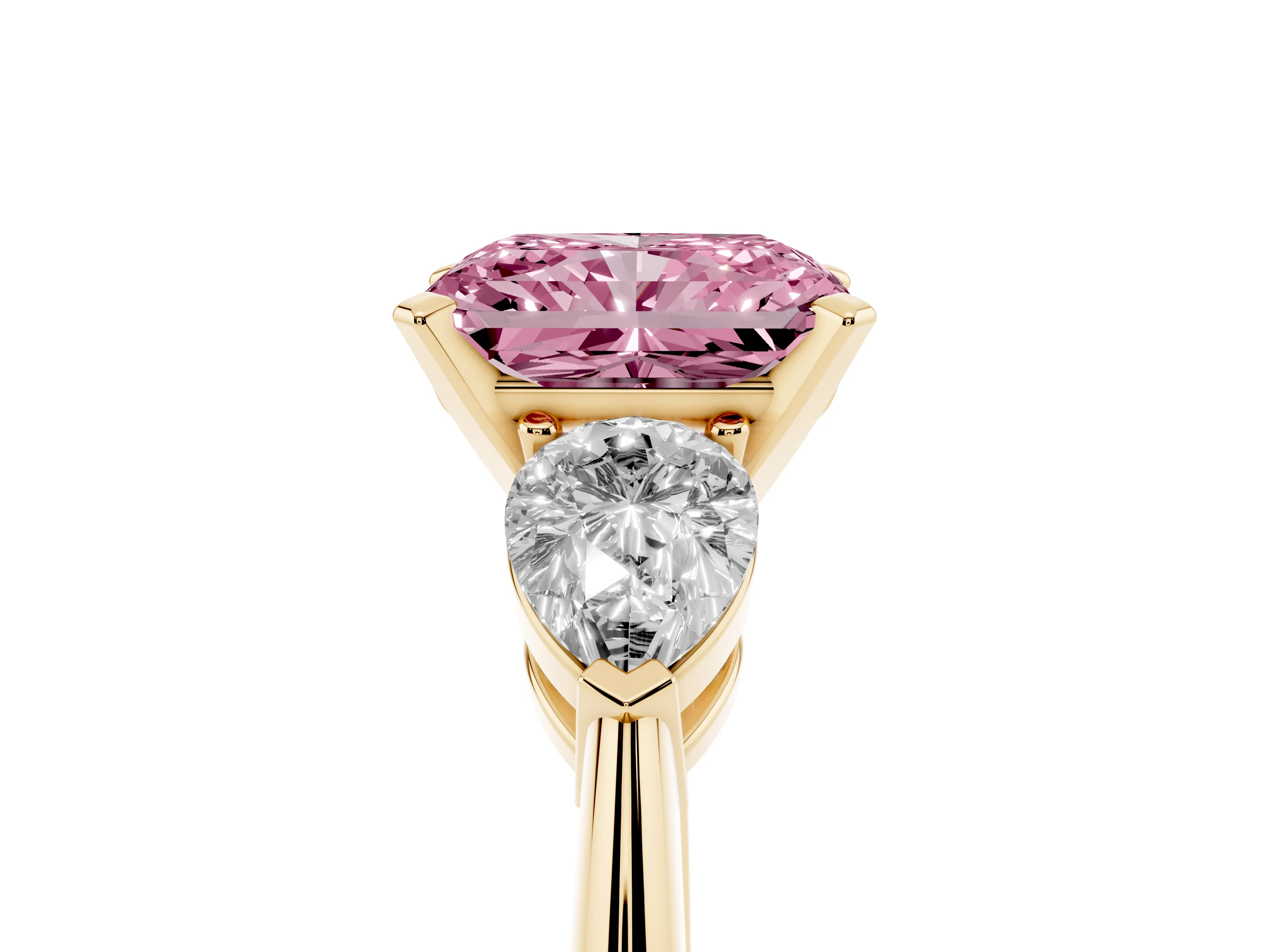 Fancy Pink Three-Stone Radiant Cut Diamond Ring Set in Yellow gold with Pear Side Stones and Prong Setting
