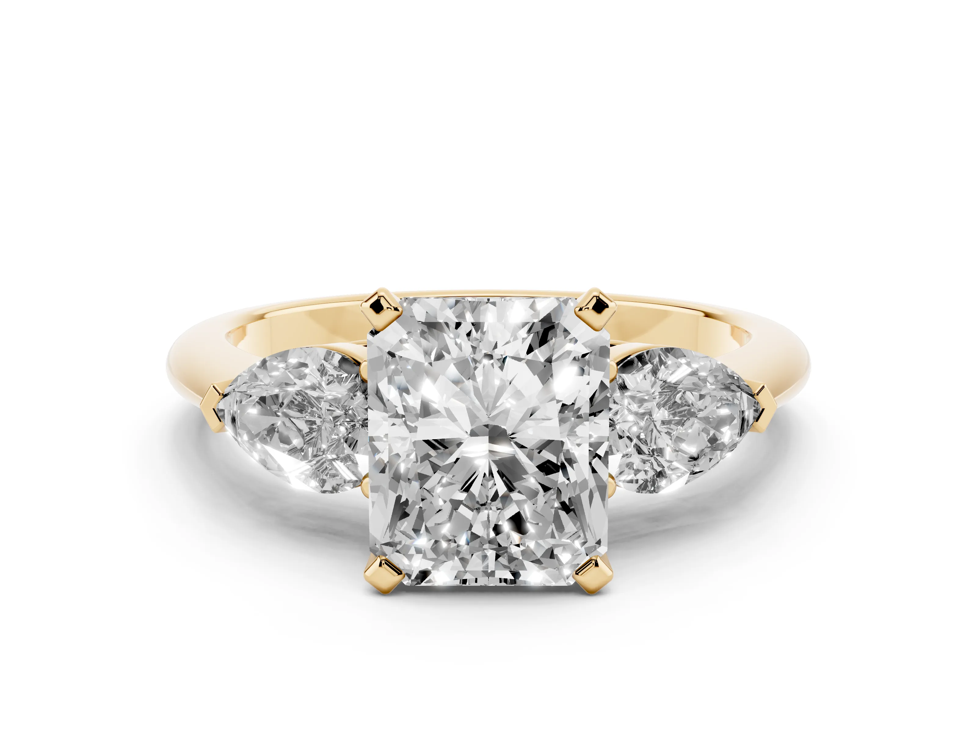 Three-Stone Radiant Cut Diamond Ring Set in Yellow gold with Pear Side Stones and Prong Setting