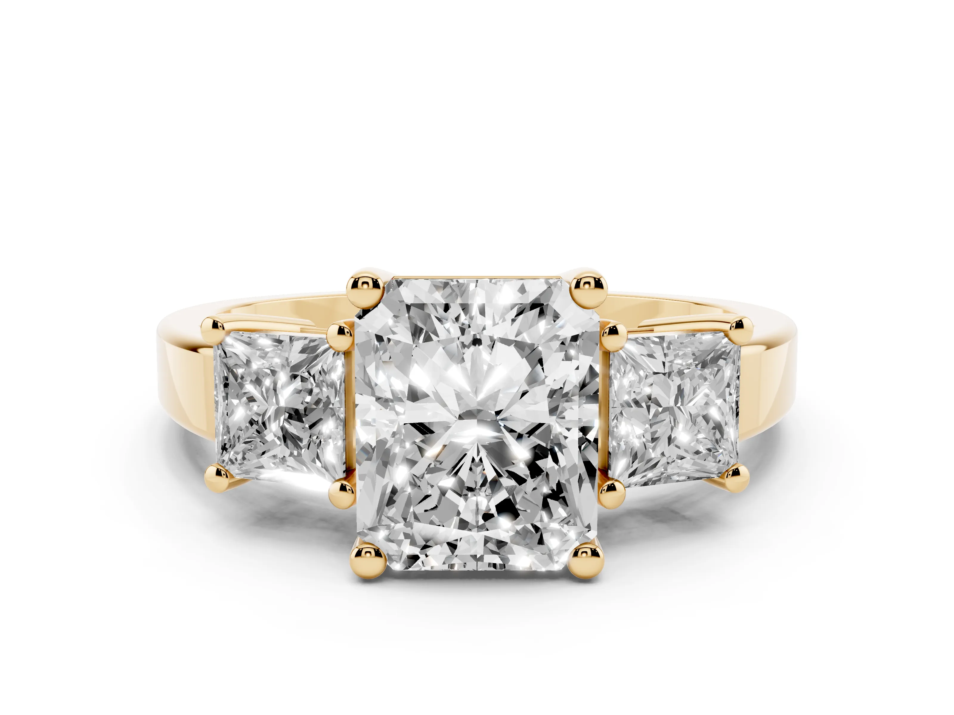 Three-Stone Radiant Cut Diamond Solitaire Ring Set in Yellow gold with Prong Setting