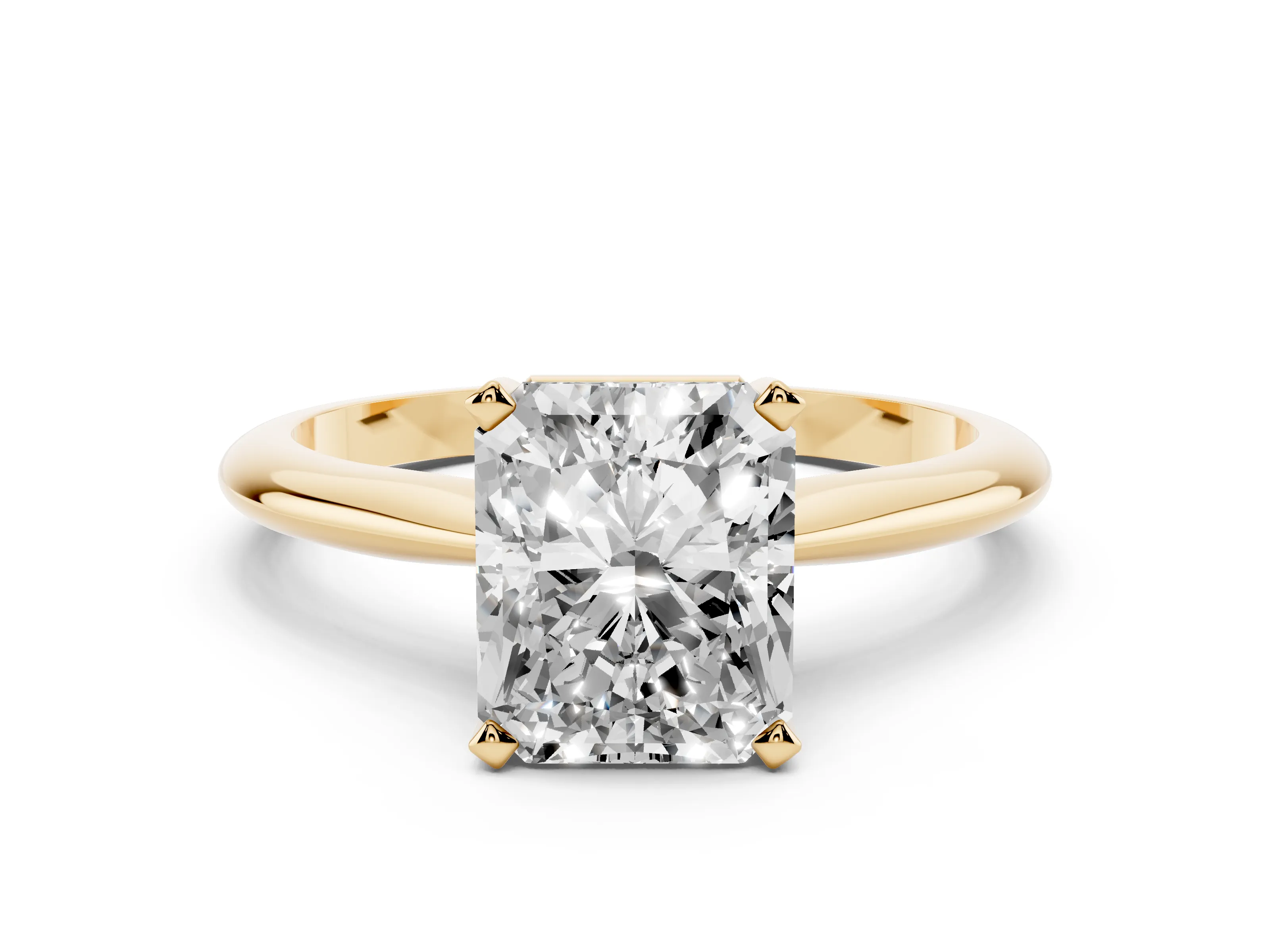Radiant Cut Diamond Solitaire Ring Set in Yellow gold with Prong Setting on a Plain Round Band