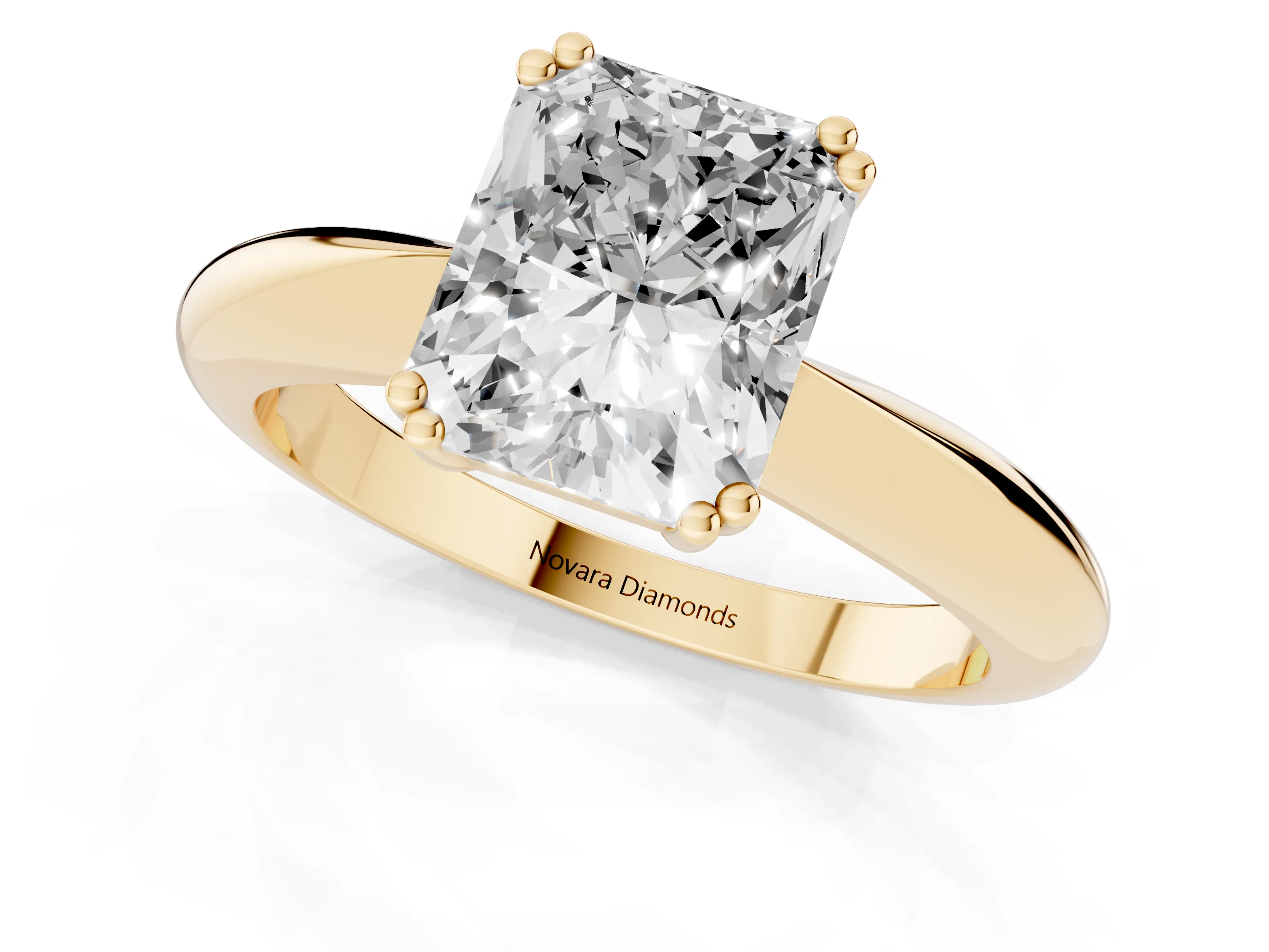 Radiant Cut Diamond Solitaire Engagement Ring Set in Yellow gold with Tapered Band and Prong Setting