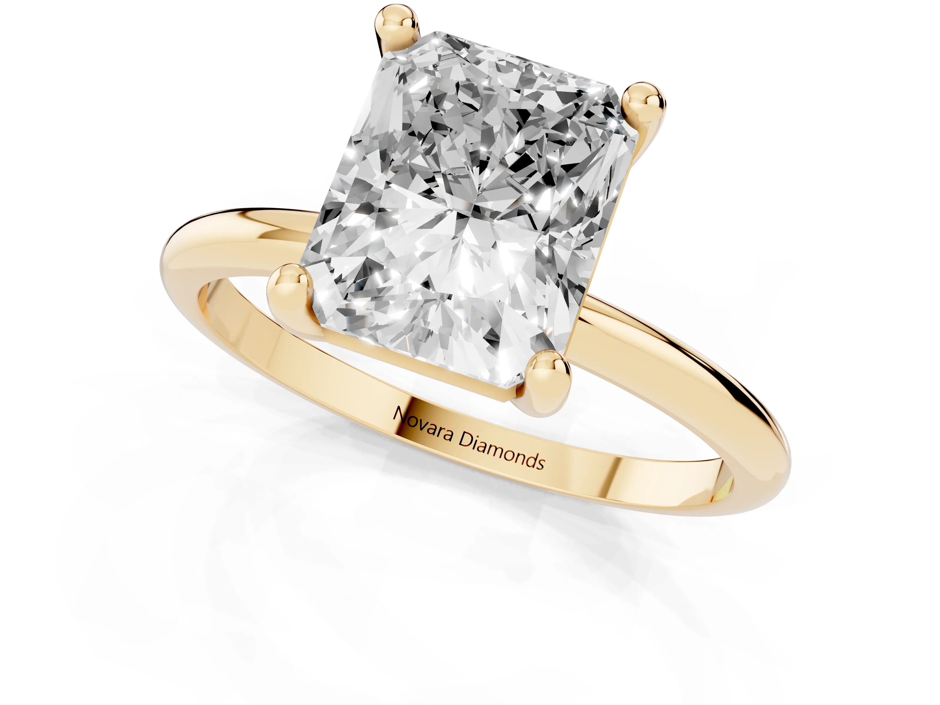 Radiant Cut Diamond Solitaire Ring Set in Yellow gold with Secure Prong Setting on a Classic Band
