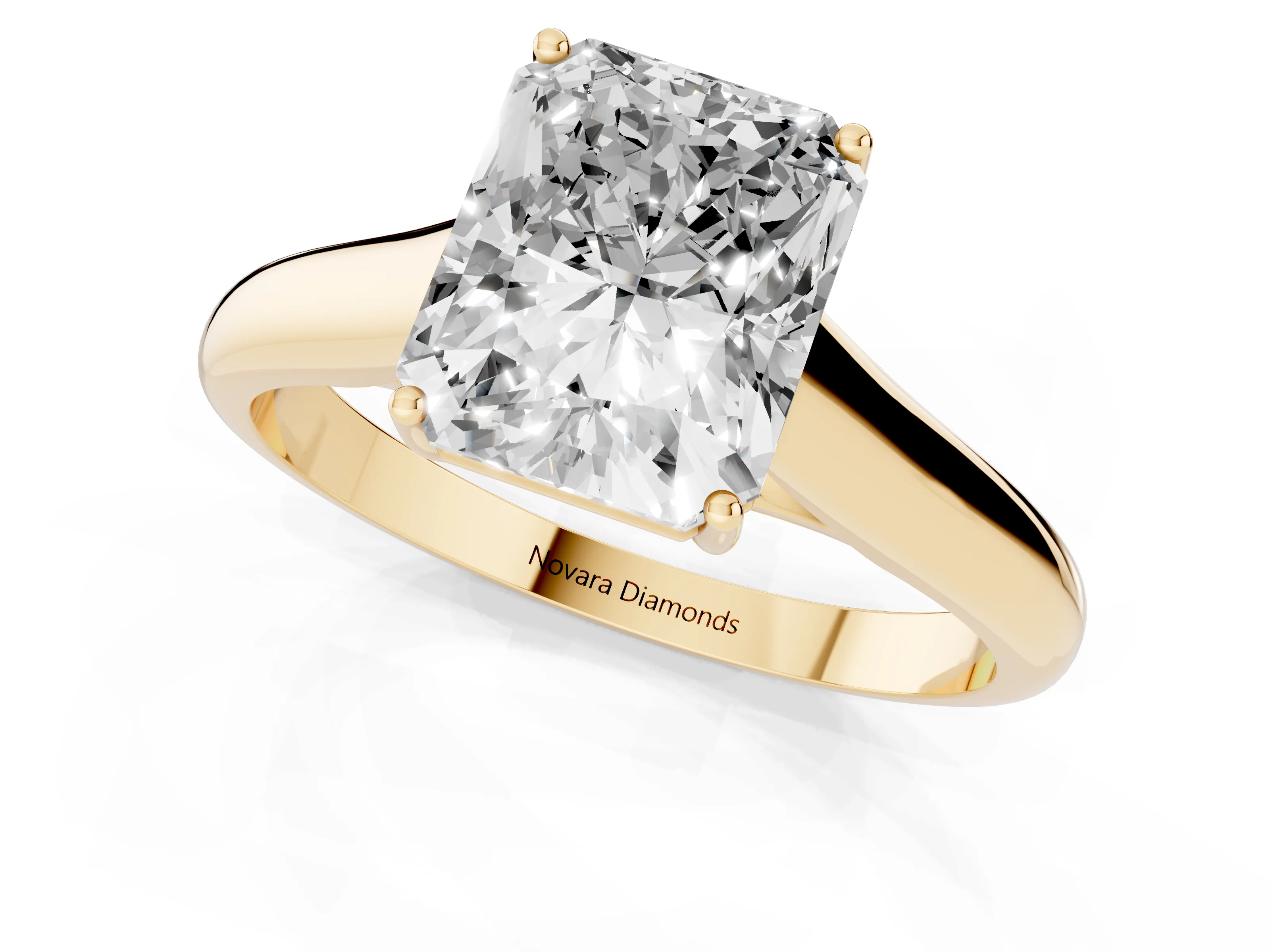 Radiant Cut Diamond Solitaire Engagement Ring Set in Yellow gold with Subtly Tapered Band and Prong Setting