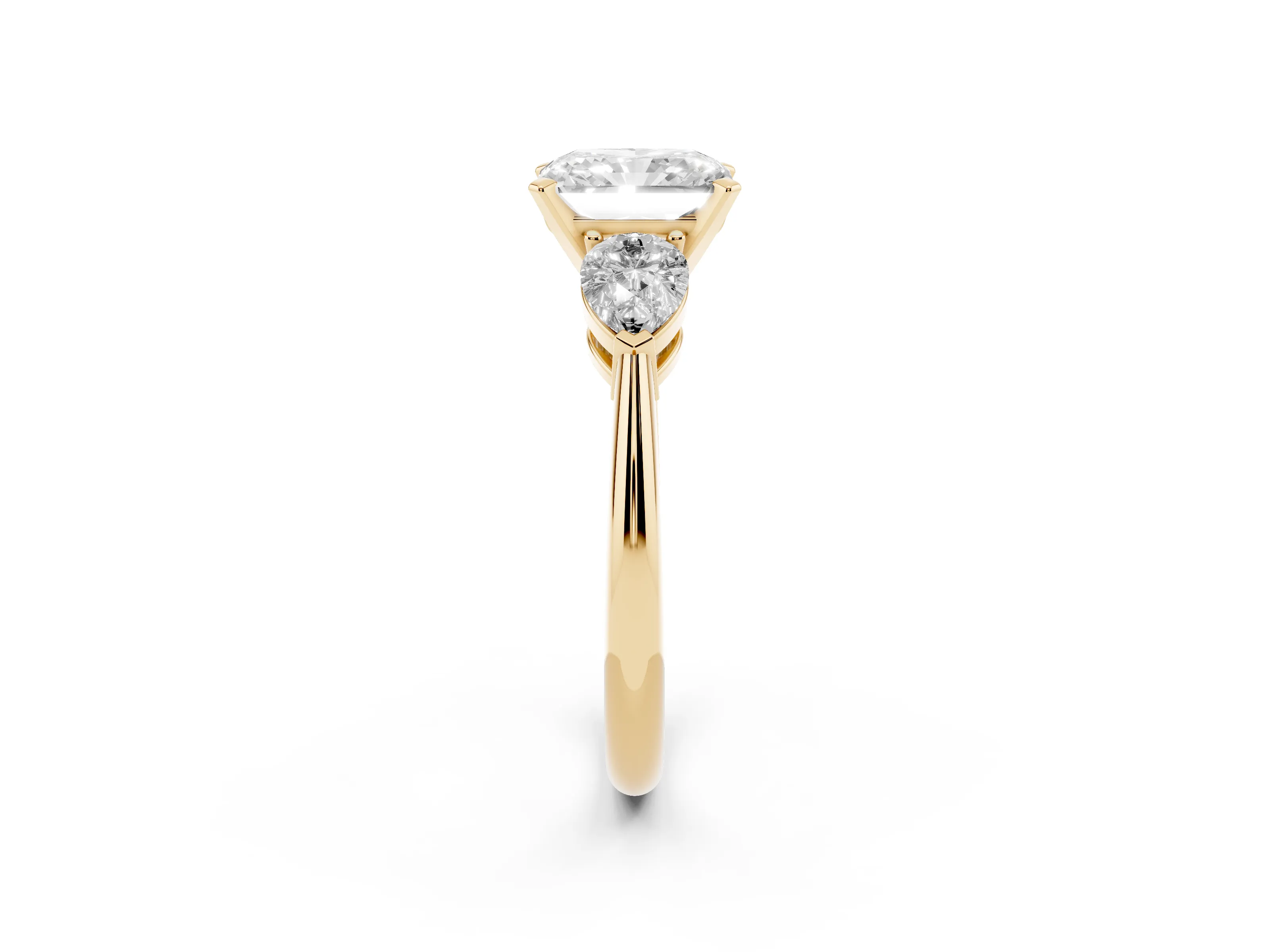 Three-Stone Radiant Cut Diamond Ring Set in Yellow gold with Pear Side Stones and Prong Setting