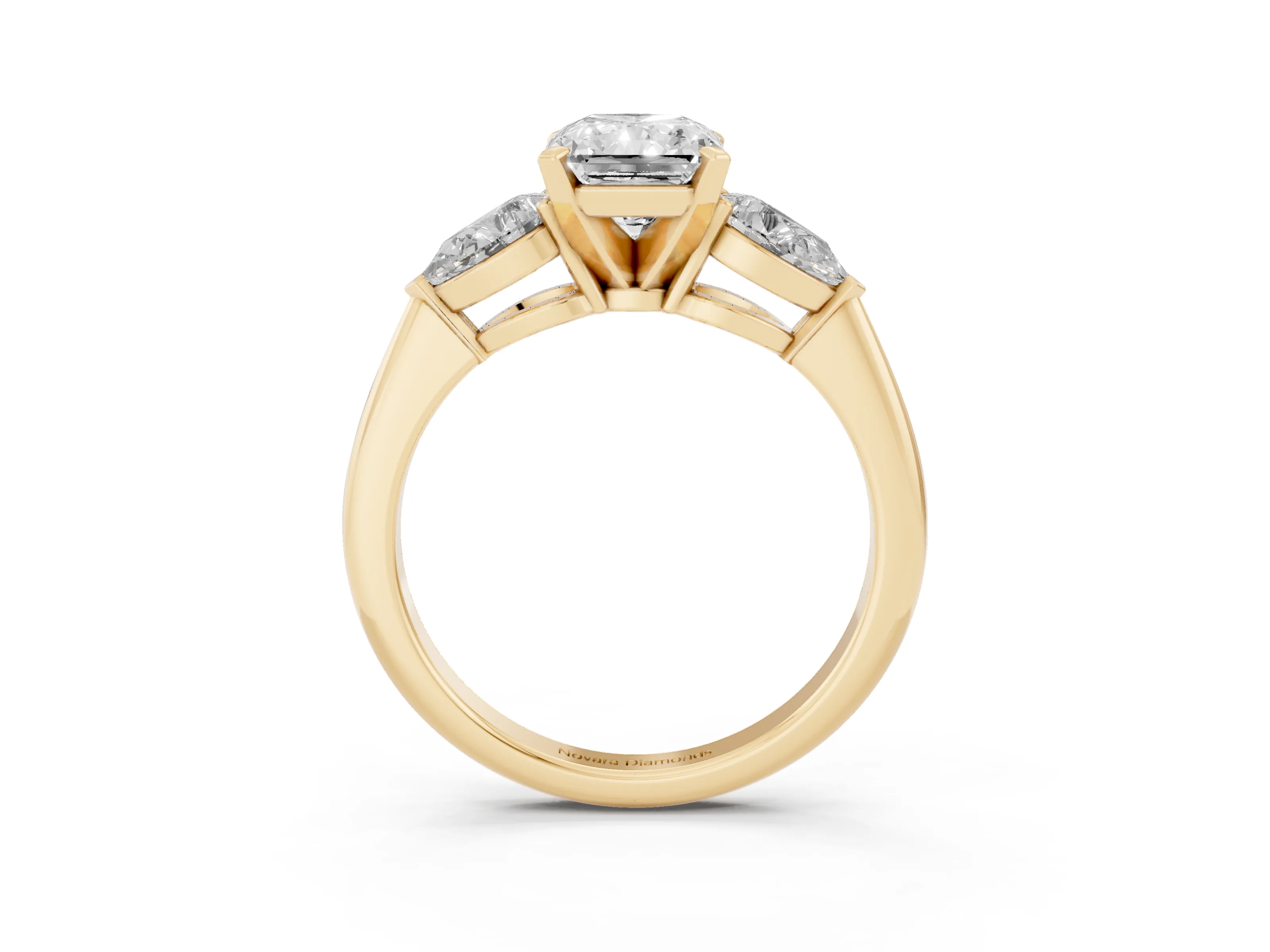 Three-Stone Radiant Cut Diamond Ring Set in Yellow gold with Pear Side Stones and Prong Setting