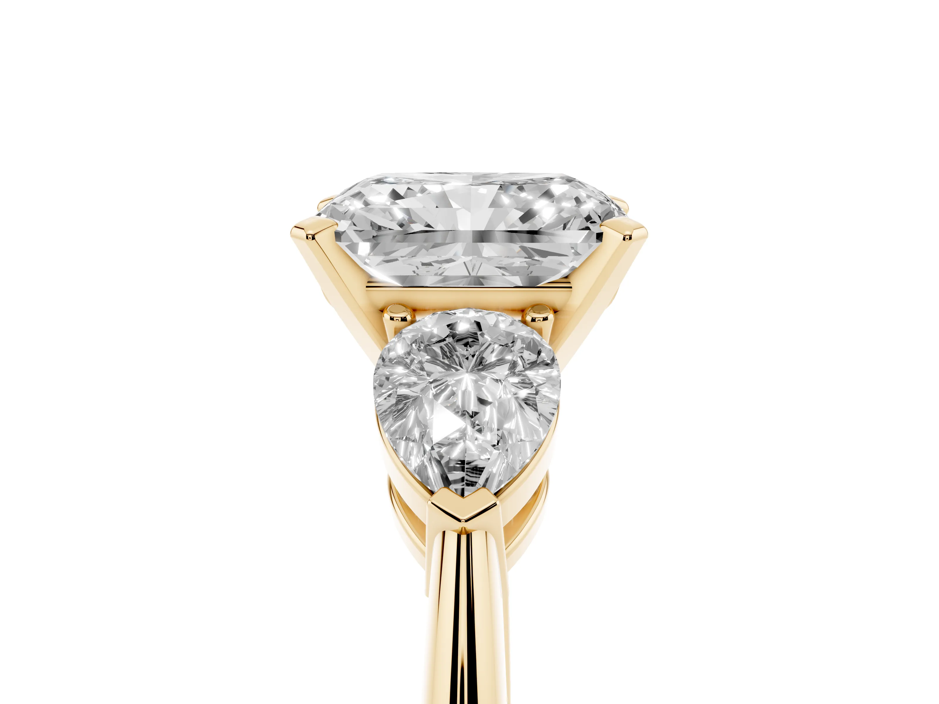 Three-Stone Radiant Cut Diamond Ring Set in Yellow gold with Pear Side Stones and Prong Setting