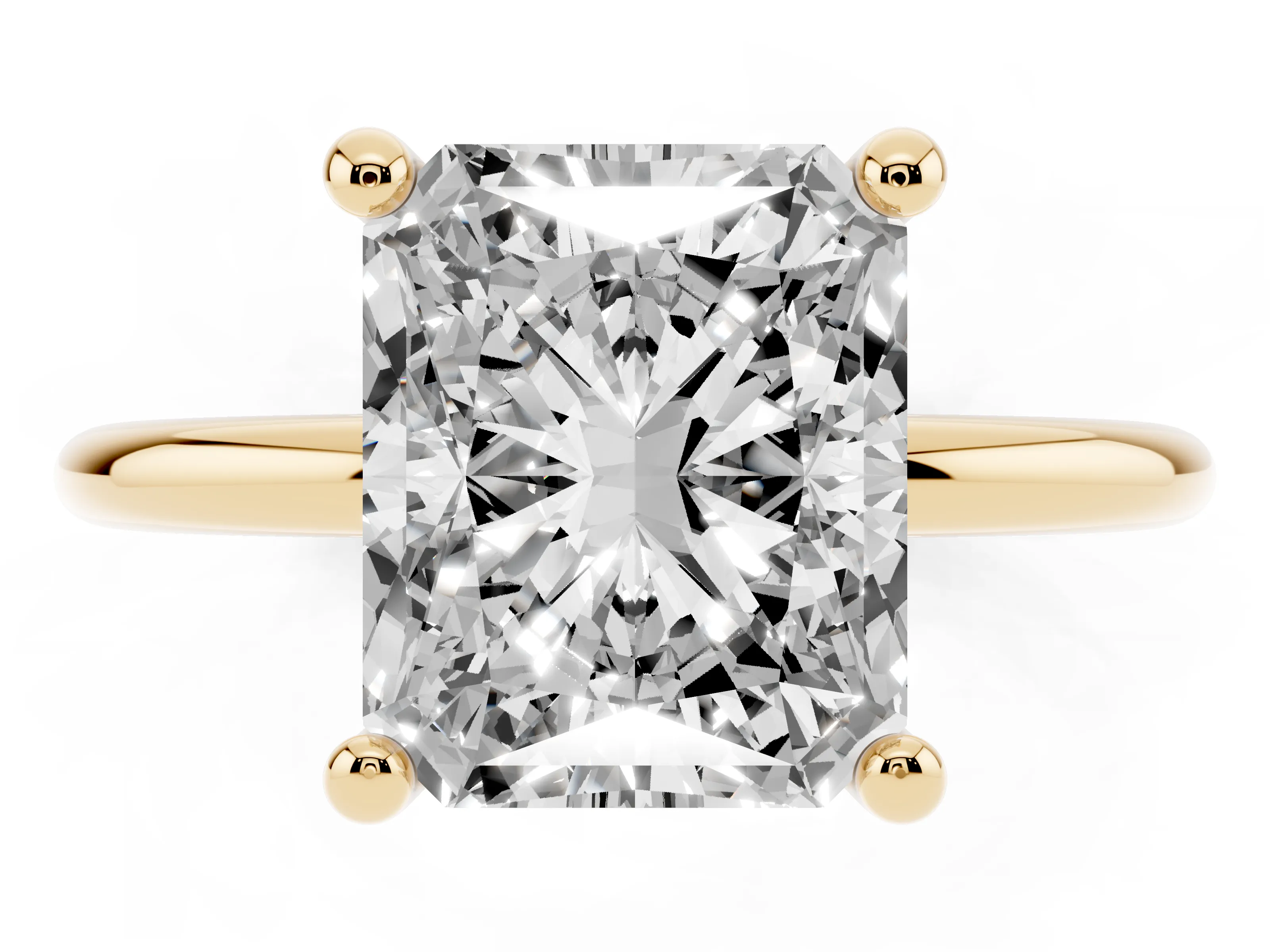 Radiant Cut Diamond Solitaire Ring Set in Yellow gold with Secure Prong Setting on a Classic Band