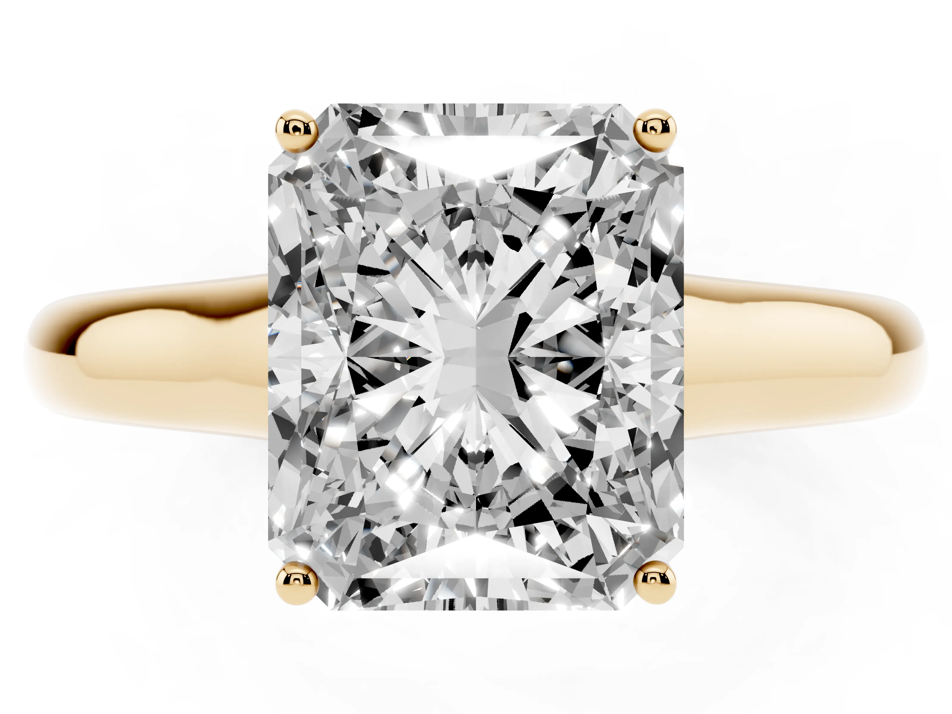 Radiant Cut Diamond Solitaire Engagement Ring Set in Yellow gold with Subtly Tapered Band and Prong Setting