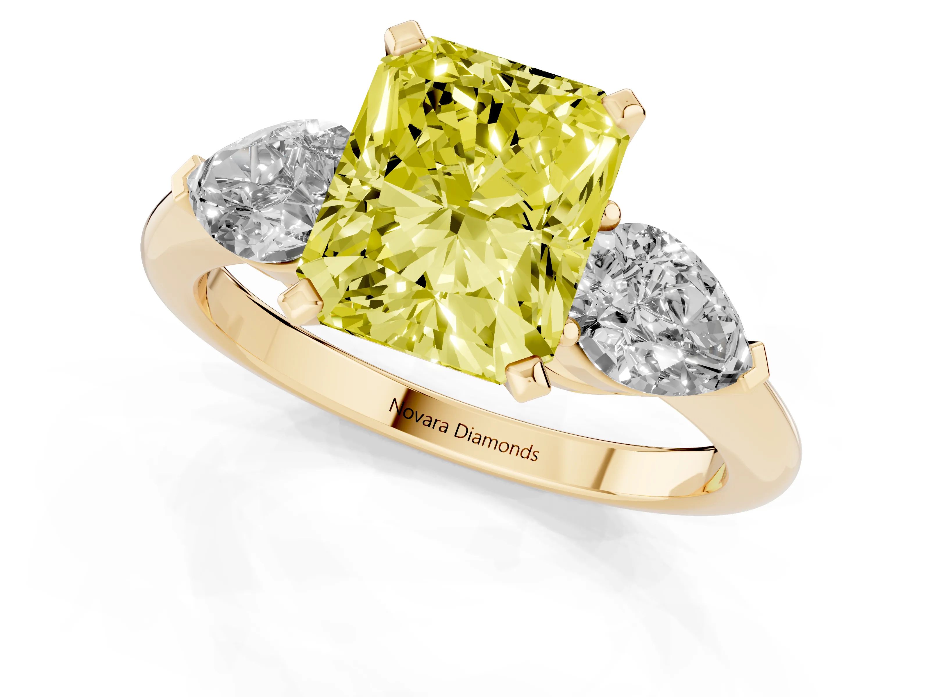 Fancy Yellow Three-Stone Radiant Cut Diamond Ring Set in Yellow gold with Pear Side Stones and Prong Setting