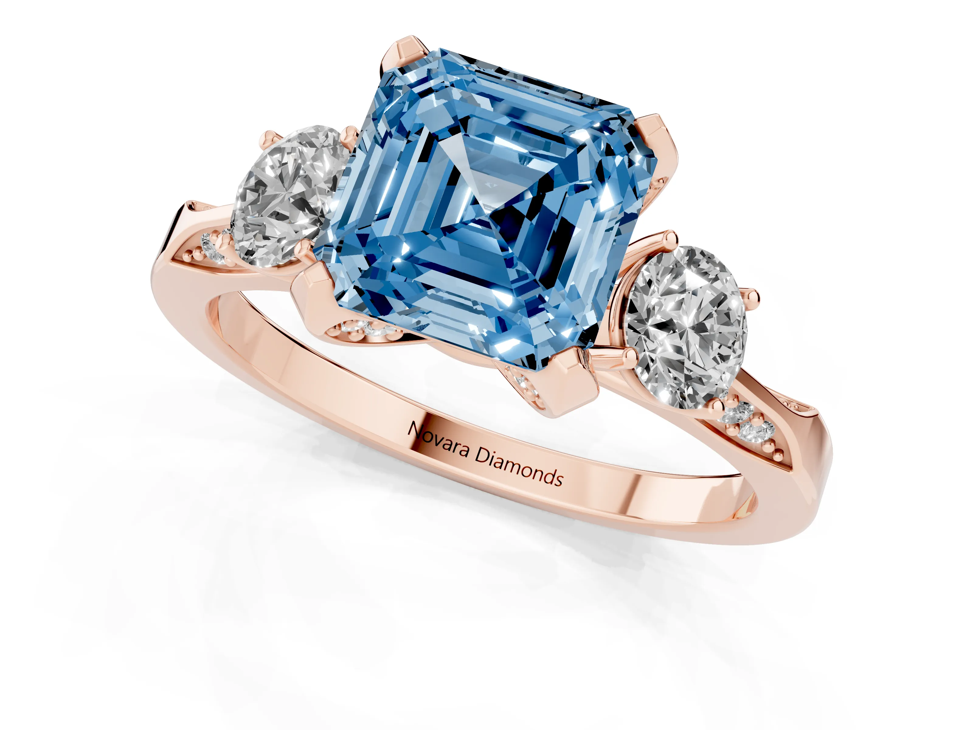 Fancy Blue Asscher Cut Diamond Three-Stone Ring Set in Rose gold with Pavé Band and Smaller Side Stones