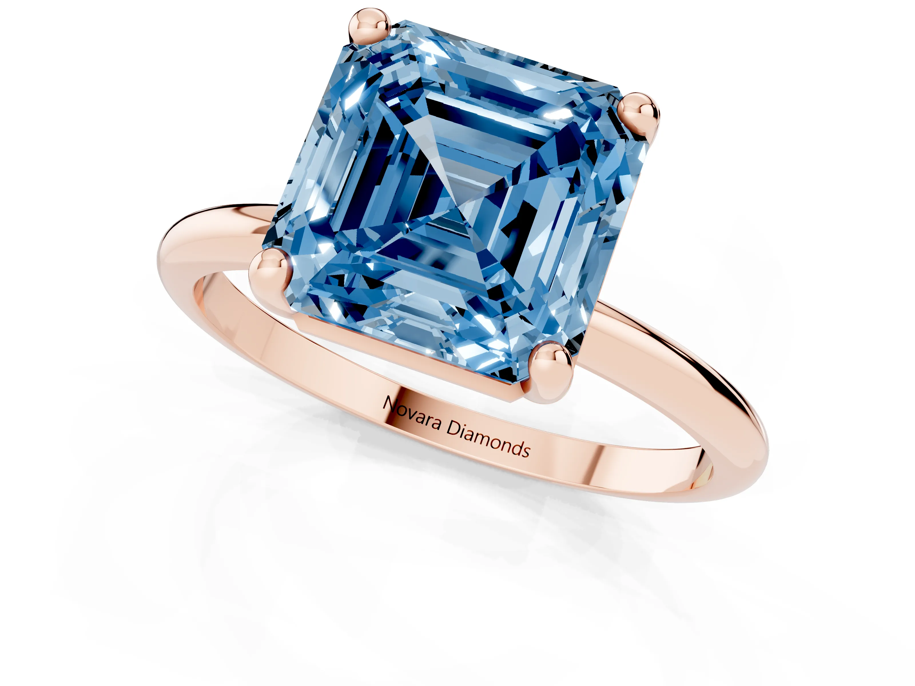 Fancy Blue Asscher Cut Diamond Solitaire Ring Set in Rose gold with Secure Prong Setting on a Classic Band