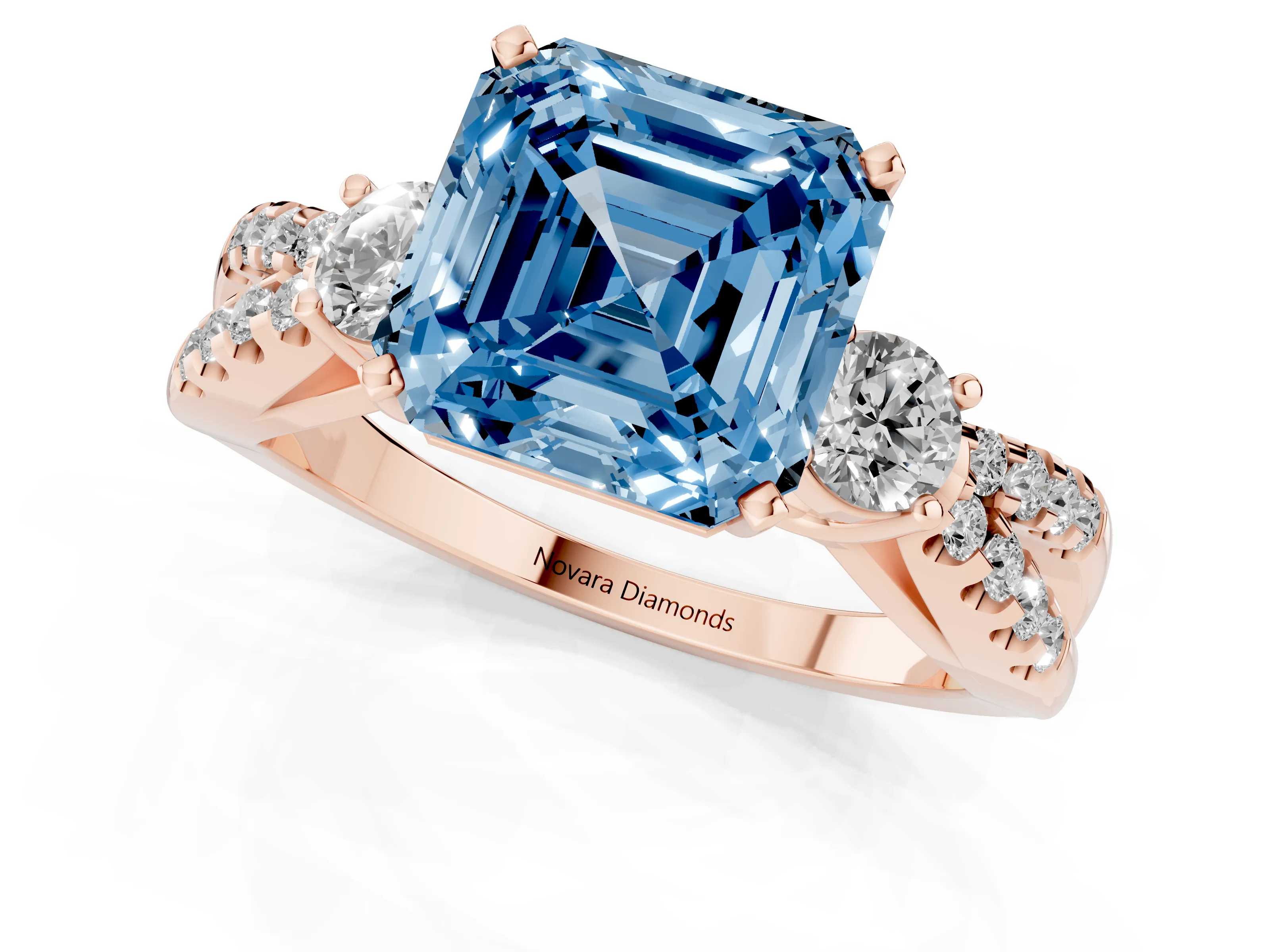 Fancy Blue Asscher Cut Diamond Three-Stone Ring Set in Rose gold with Pavé Split Shank and Prong Setting