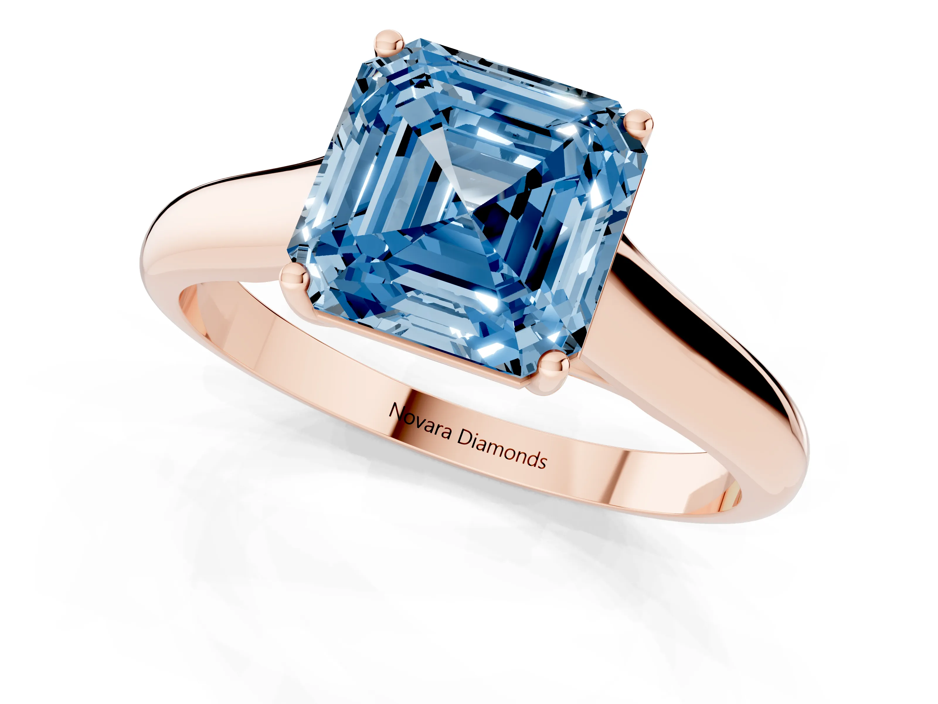 Fancy Blue Asscher Cut Diamond Solitaire Engagement Ring Set in Rose gold with Subtly Tapered Band and Prong Setting