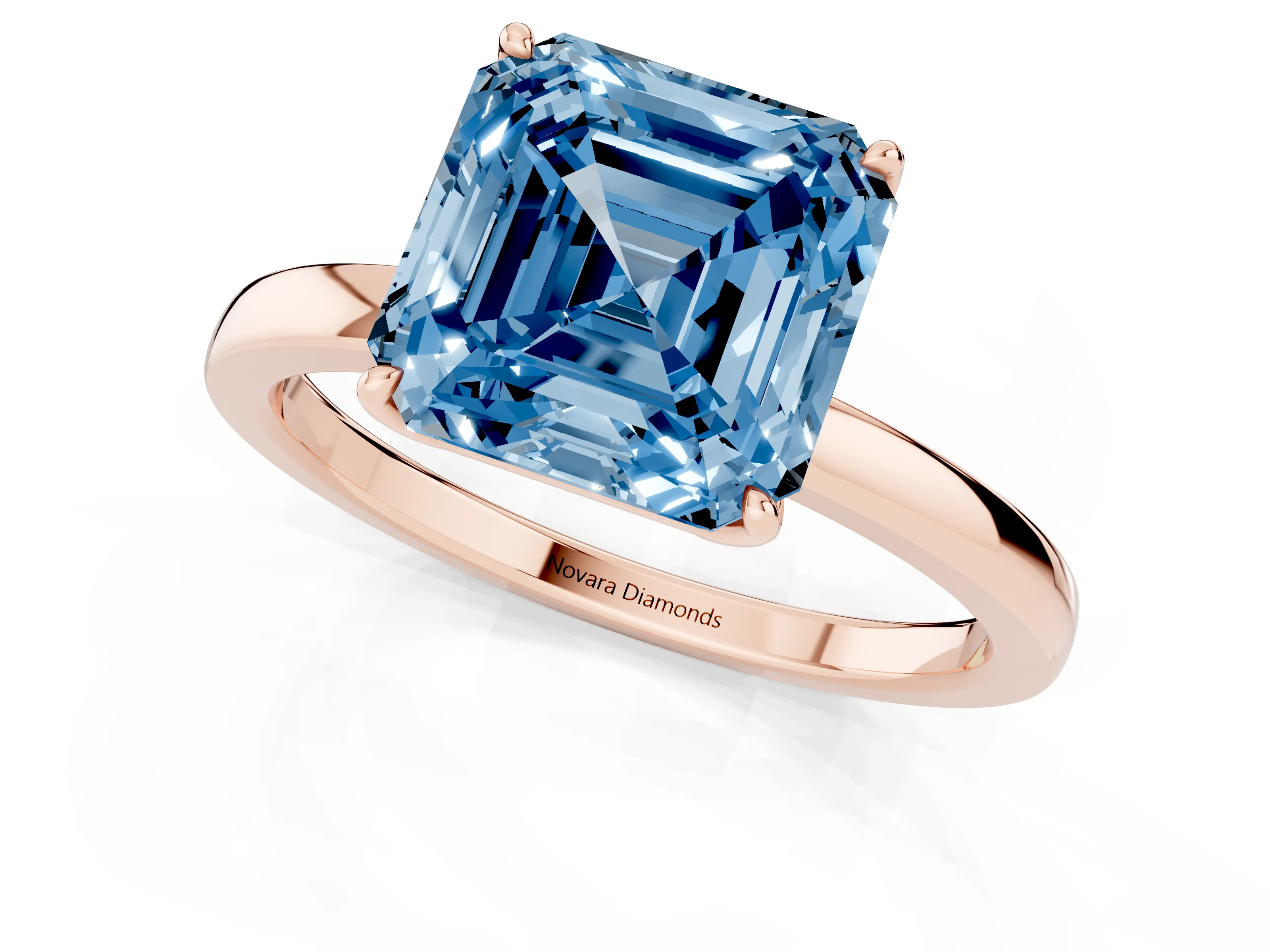 Fancy Blue Asscher Cut Diamond Solitaire Ring Set in Rose gold with Prong Setting and Thin Polished Band
