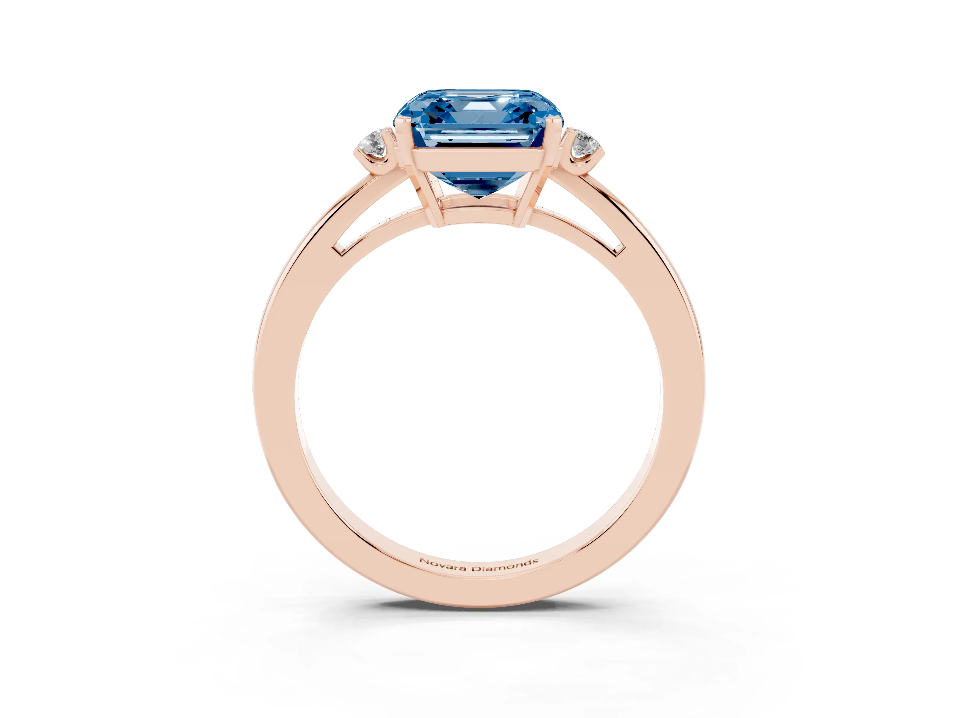 Fancy Blue Three-Stone Asscher Cut Diamond Solitaire Ring Set in Rose gold with Round Accent Stones and Prong Setting