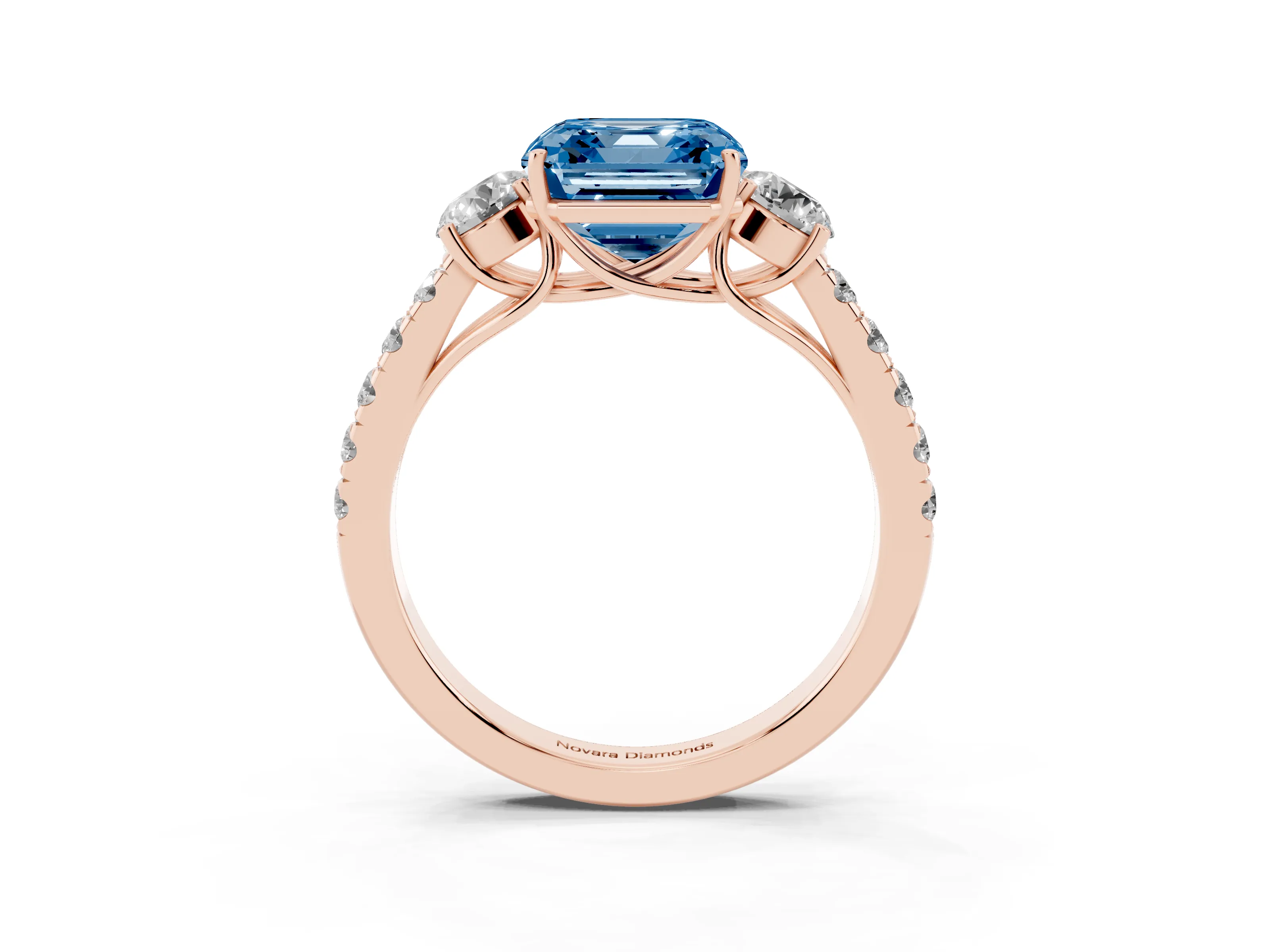 Fancy Blue Asscher Cut Diamond Three-Stone Ring Set in Rose gold with Round Side Stones and Delicate Pavé Band