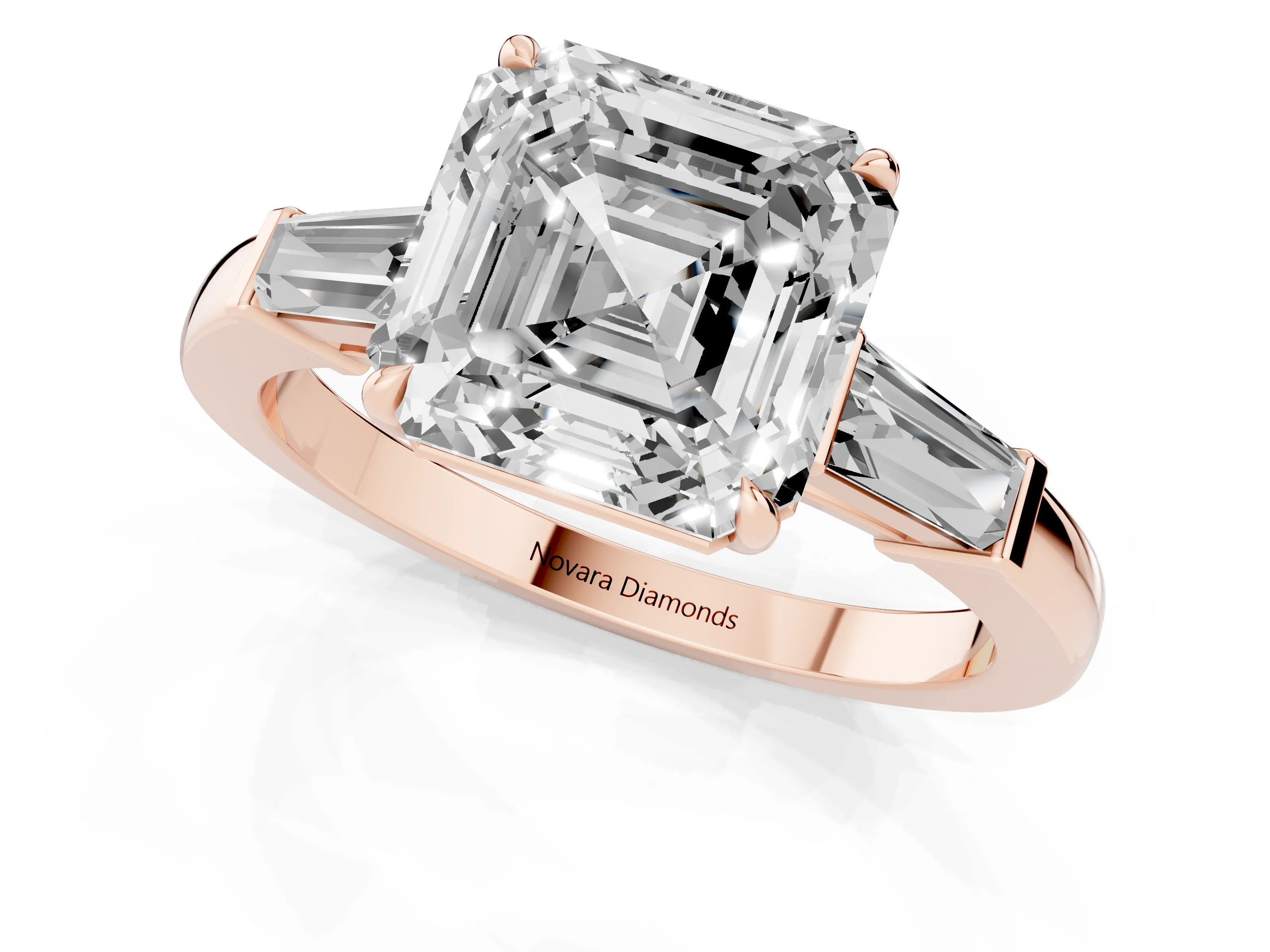 Asscher Cut Diamond Three-Stone Ring Set in Rose gold with Tapered Baguette Side Stones and Prong Setting
