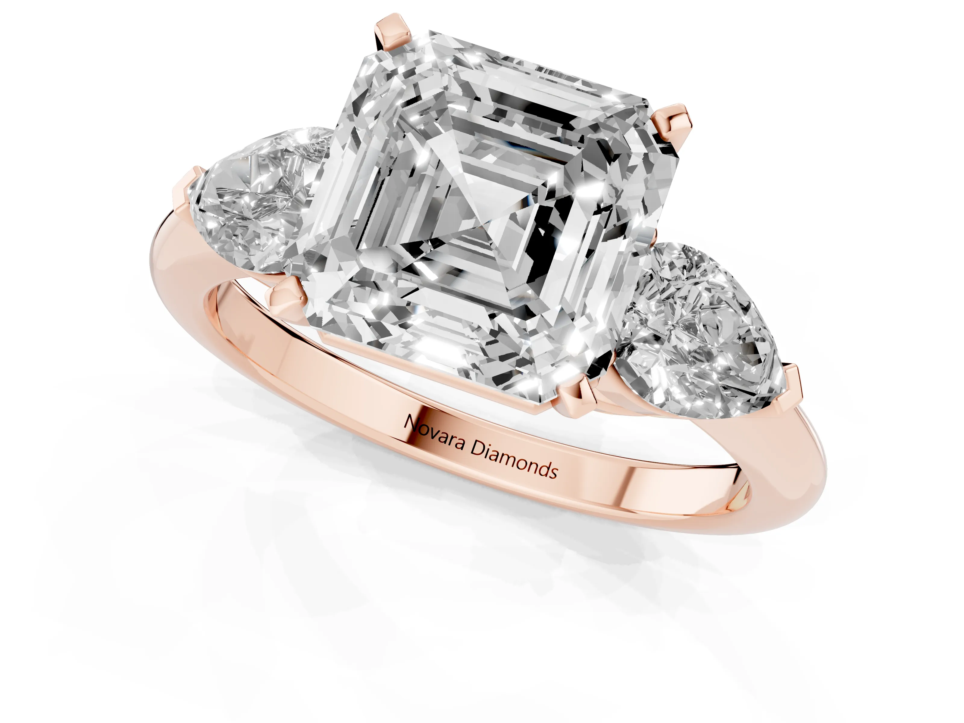 Three-Stone Asscher Cut Diamond Ring Set in Rose gold with Pear Side Stones and Prong Setting