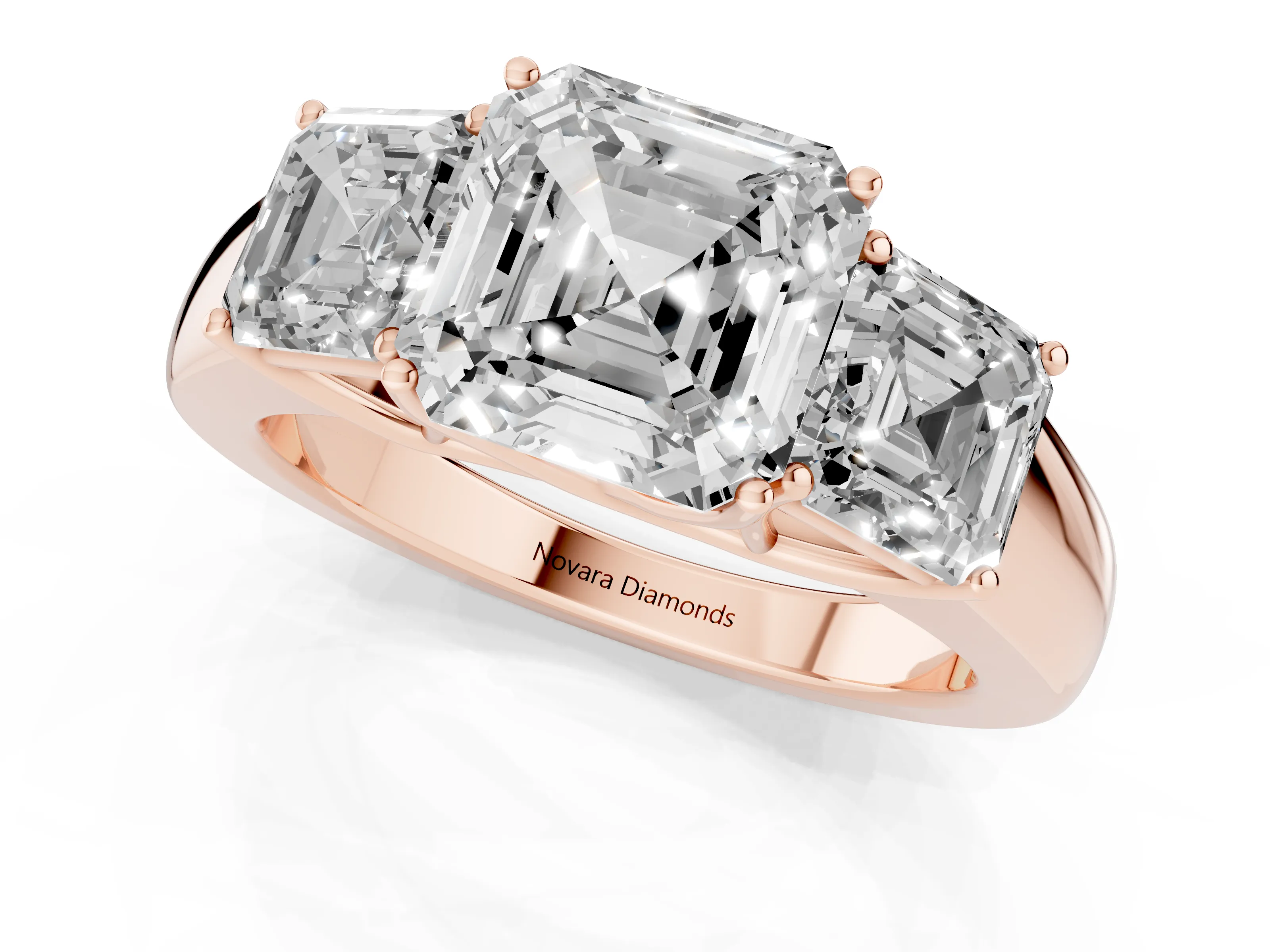 Three-Stone Asscher Cut Diamond Ring Set in Rose gold with Matching Prong Settings and Plain Band