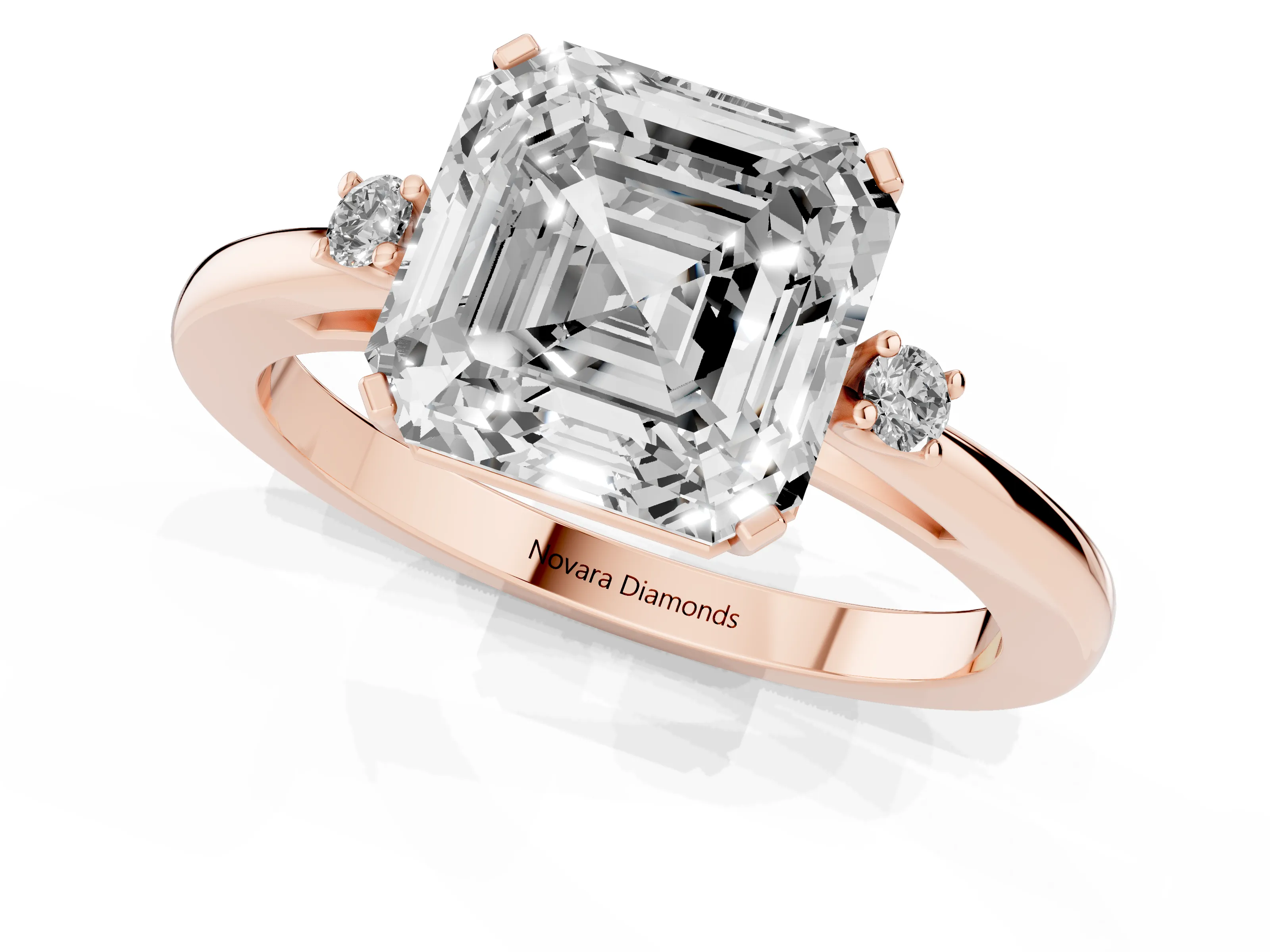 Three-Stone Asscher Cut Diamond Solitaire Ring Set in Rose gold with Round Accent Stones and Prong Setting