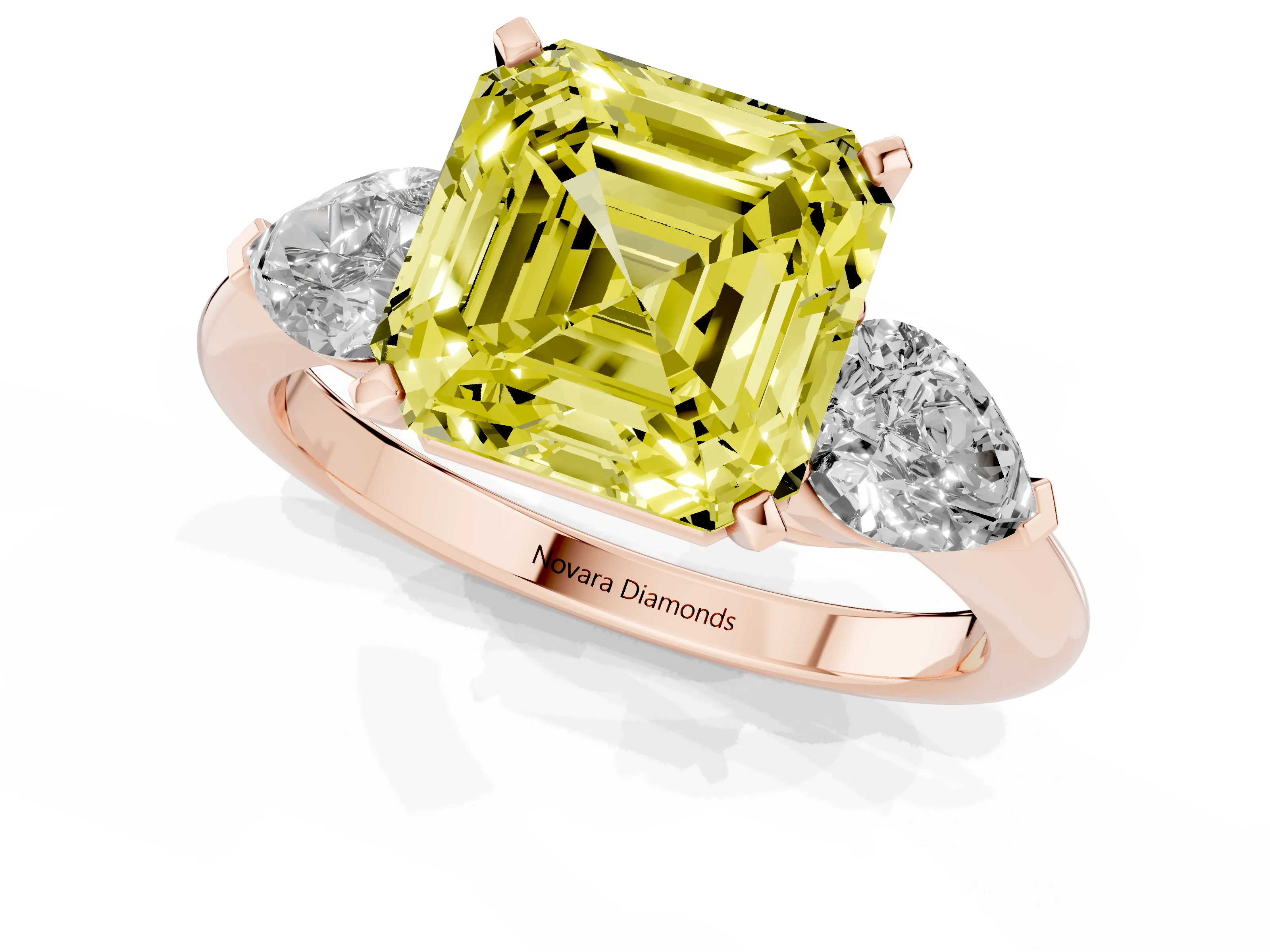 Fancy Yellow Three-Stone Asscher Cut Diamond Ring Set in Rose gold with Pear Side Stones and Prong Setting