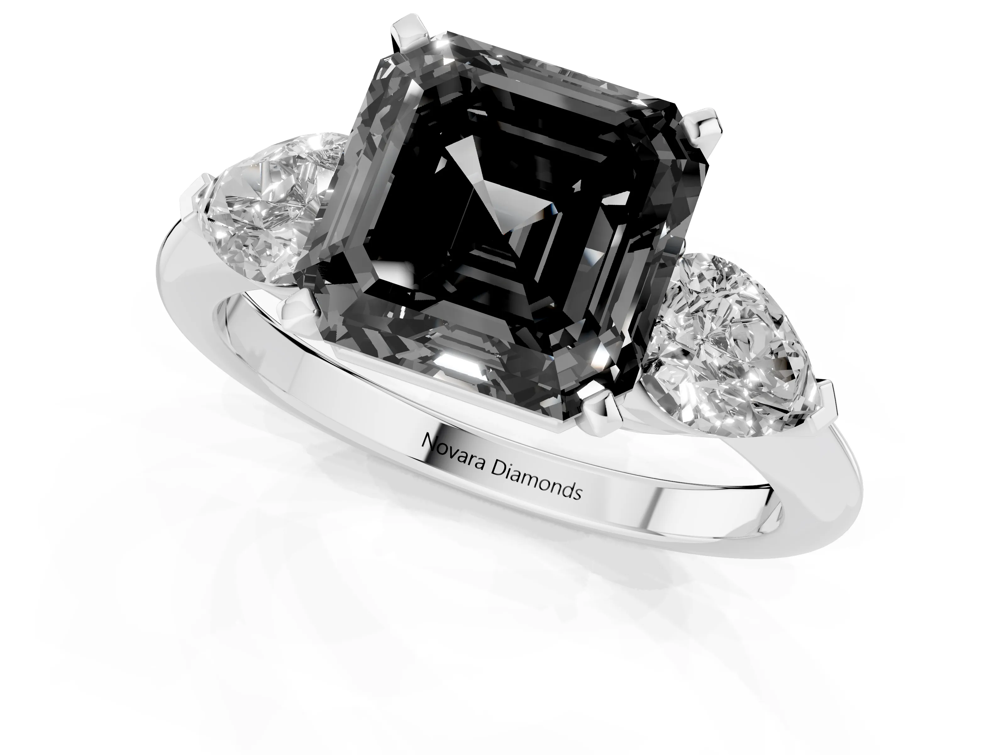 Fancy Black Three-Stone Asscher Cut Diamond Ring Set in Platinum with Pear Side Stones and Prong Setting