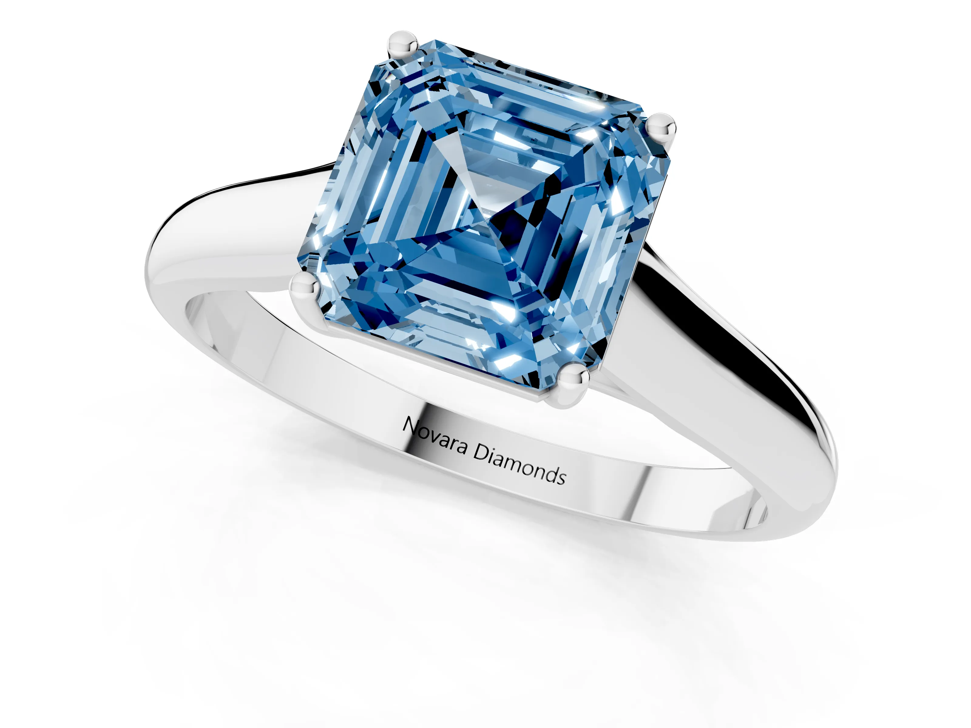 Fancy Blue Asscher Cut Diamond Solitaire Engagement Ring Set in Platinum with Subtly Tapered Band and Prong Setting