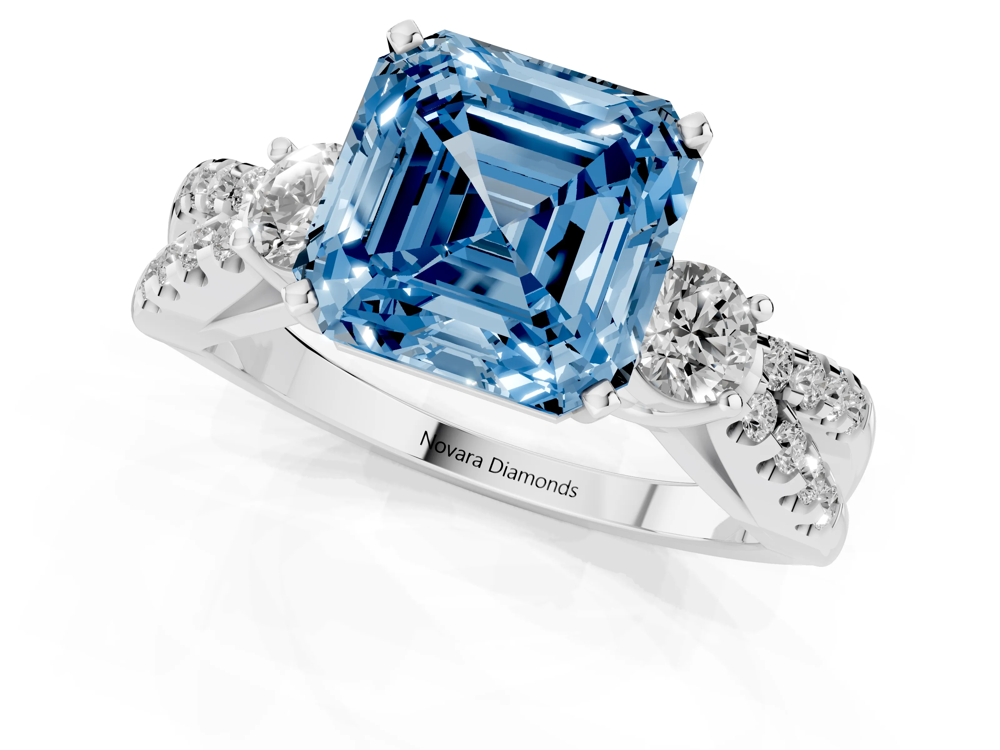 Fancy Blue Asscher Cut Diamond Three-Stone Ring Set in White gold with Pavé Split Shank and Prong Setting