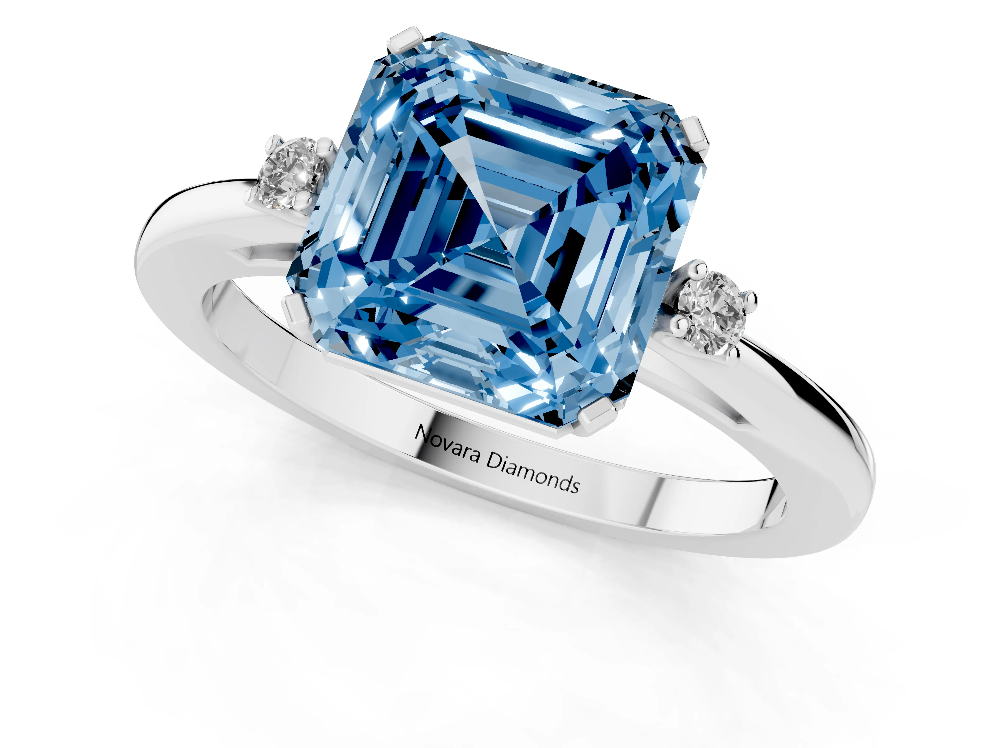 Fancy Blue Three-Stone Asscher Cut Diamond Solitaire Ring Set in Platinum with Round Accent Stones and Prong Setting