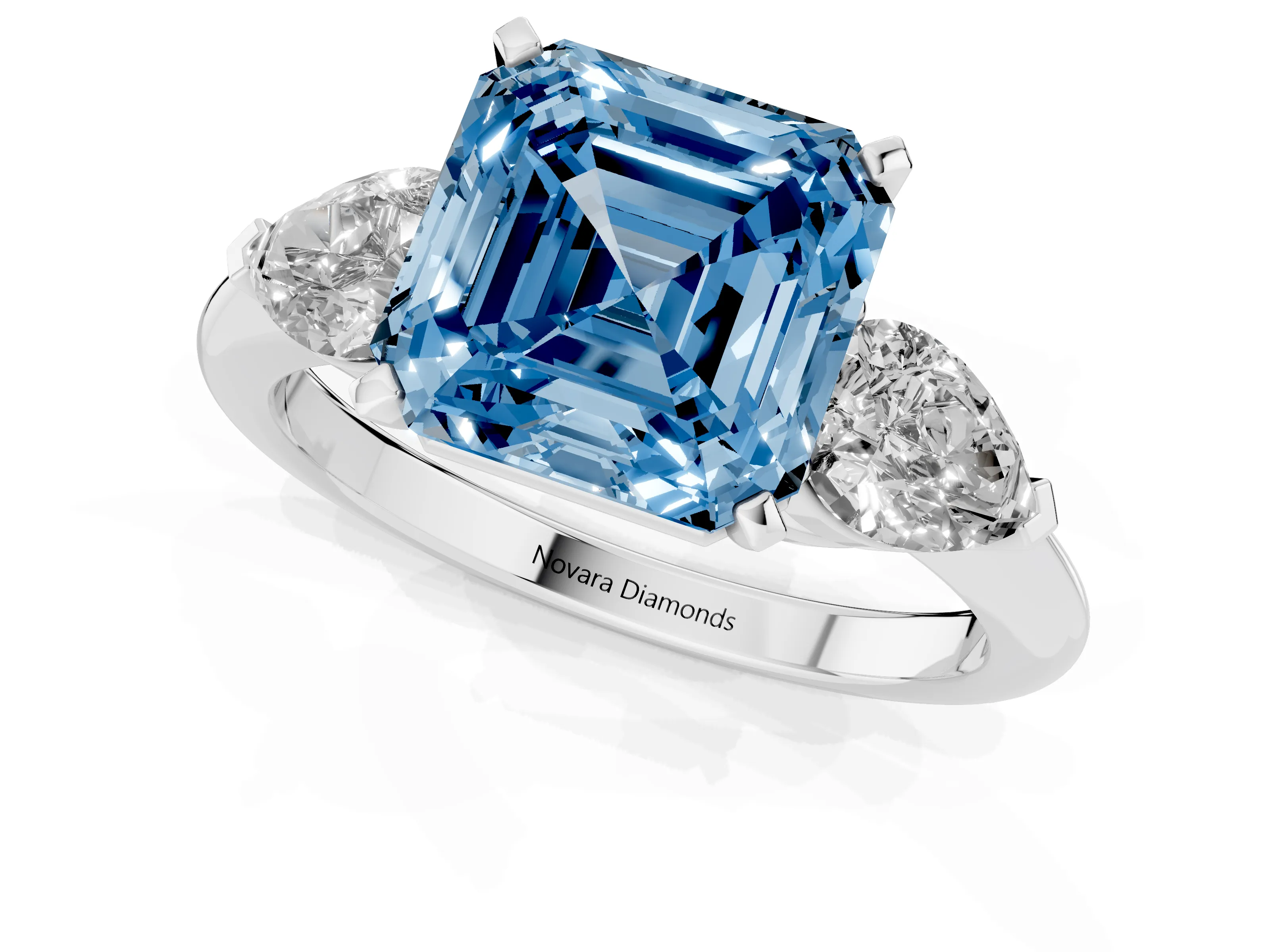 Fancy Blue Three-Stone Asscher Cut Diamond Ring Set in White gold with Pear Side Stones and Prong Setting