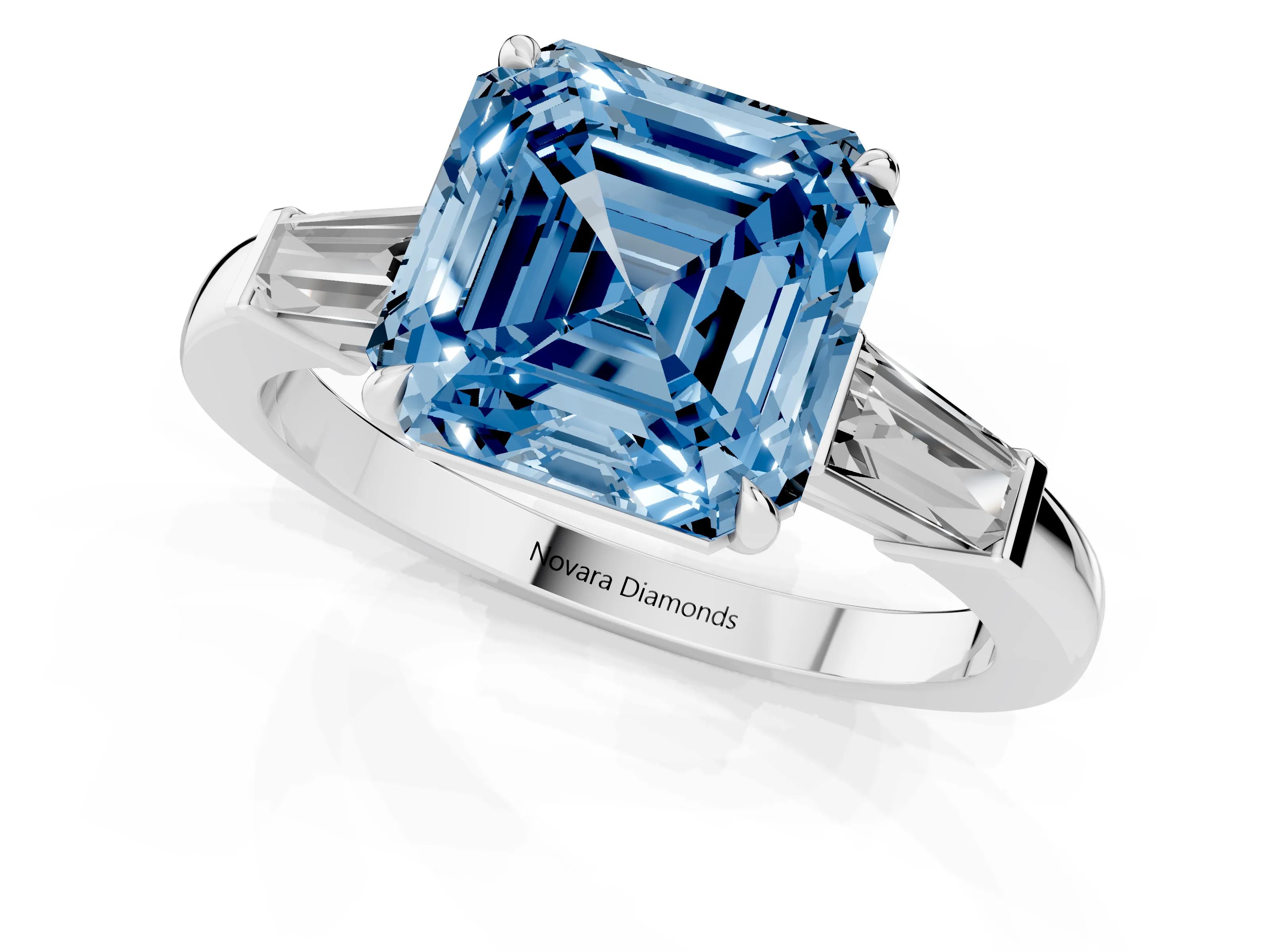 Fancy Blue Asscher Cut Diamond Three-Stone Ring Set in White gold with Tapered Baguette Side Stones and Prong Setting