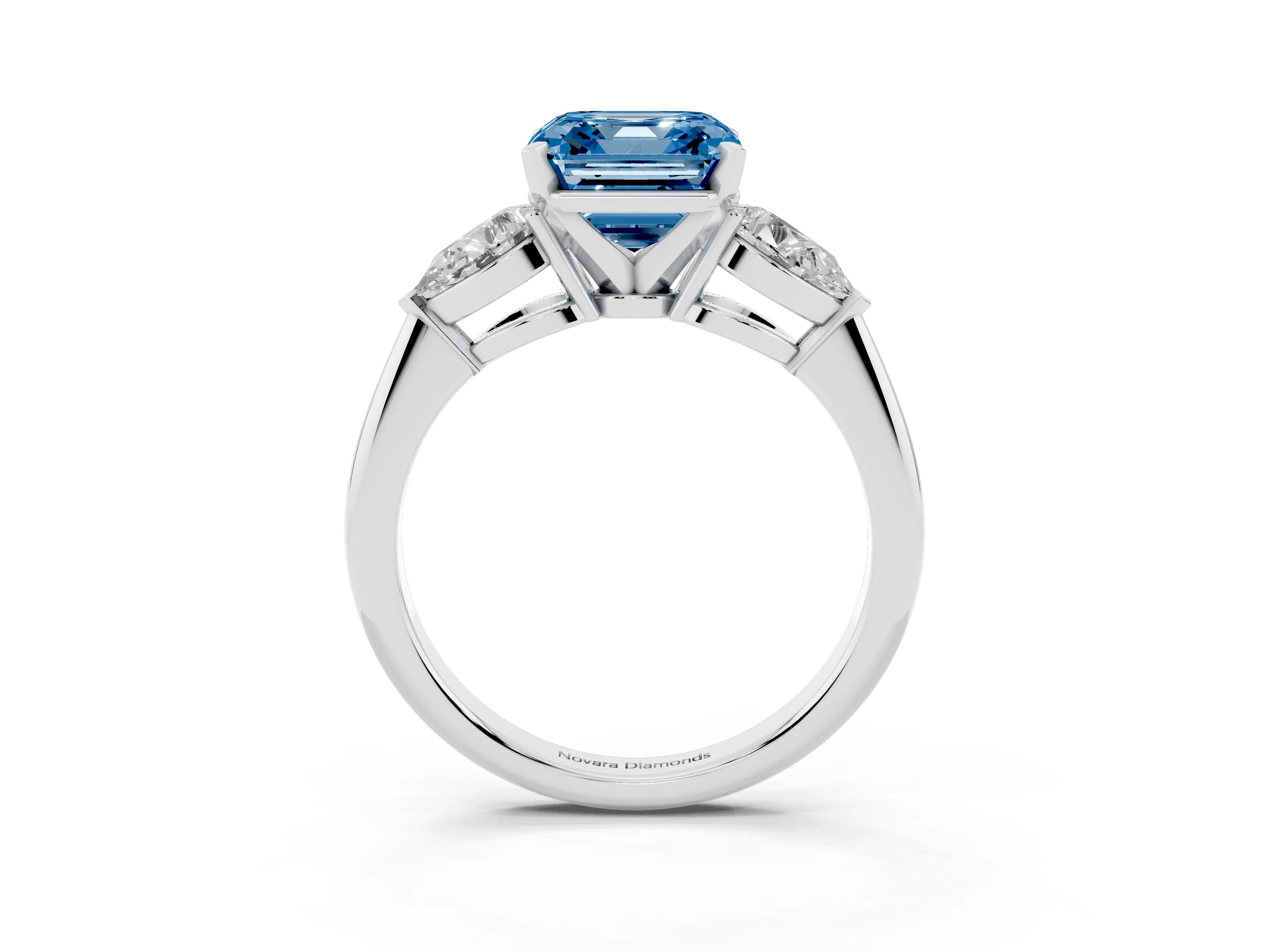 Fancy Blue Three-Stone Asscher Cut Diamond Ring Set in White gold with Pear Side Stones and Prong Setting