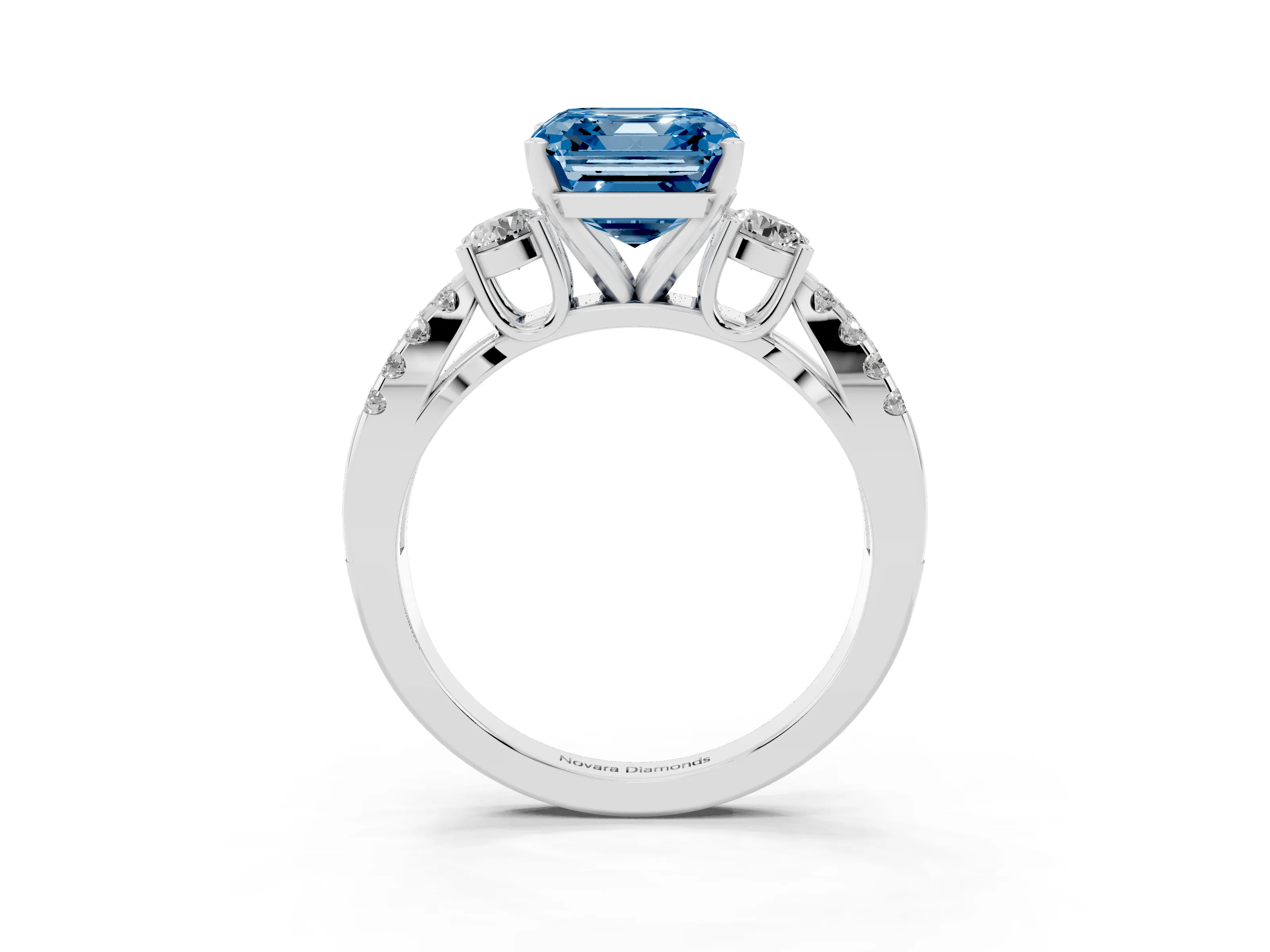 Fancy Blue Asscher Cut Diamond Three-Stone Ring Set in White gold with Pavé Split Shank and Prong Setting