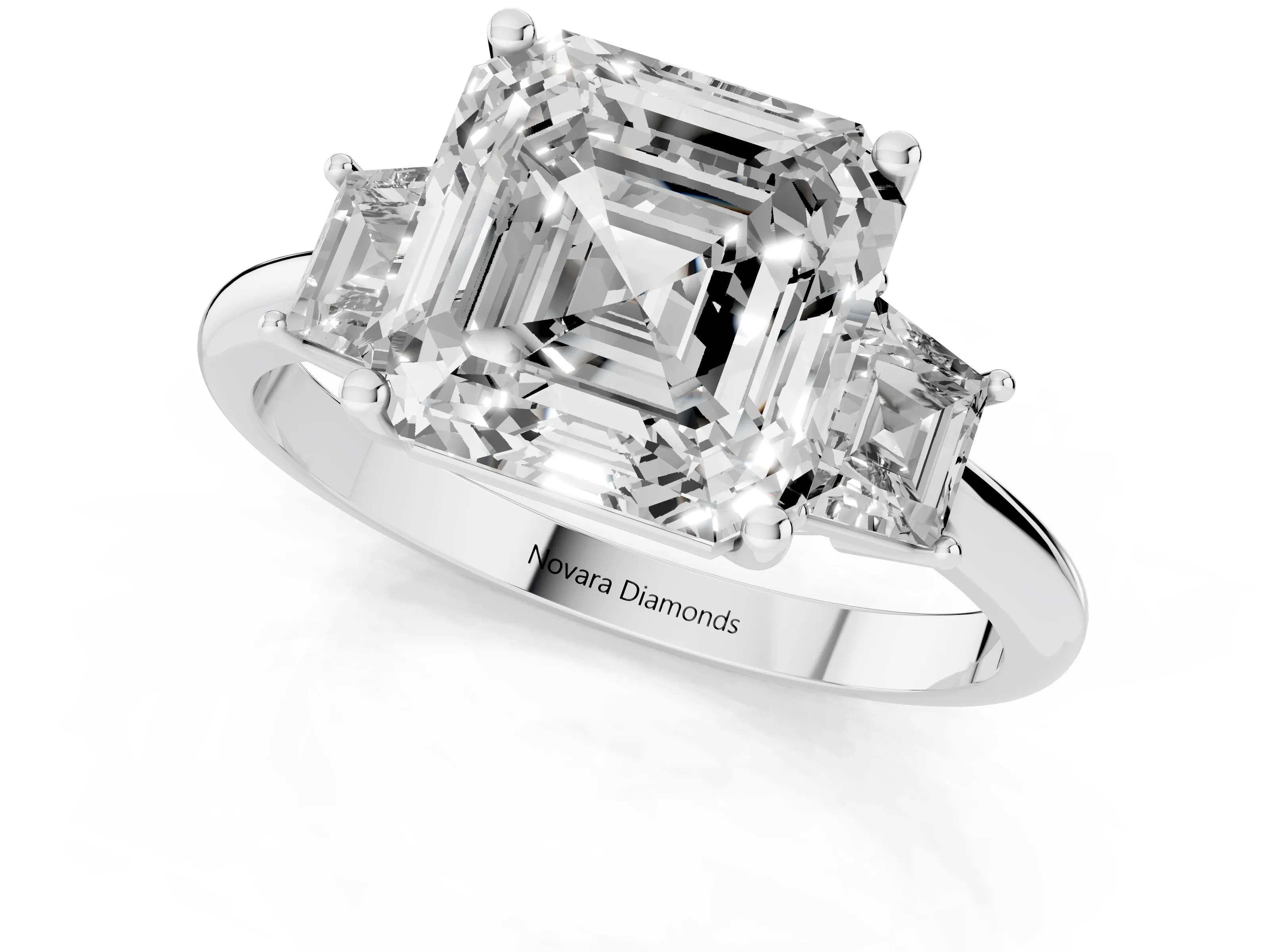 Asscher Cut Diamond Three-Stone Ring Set in White gold with Trapezoid Side Stones and Prong Setting