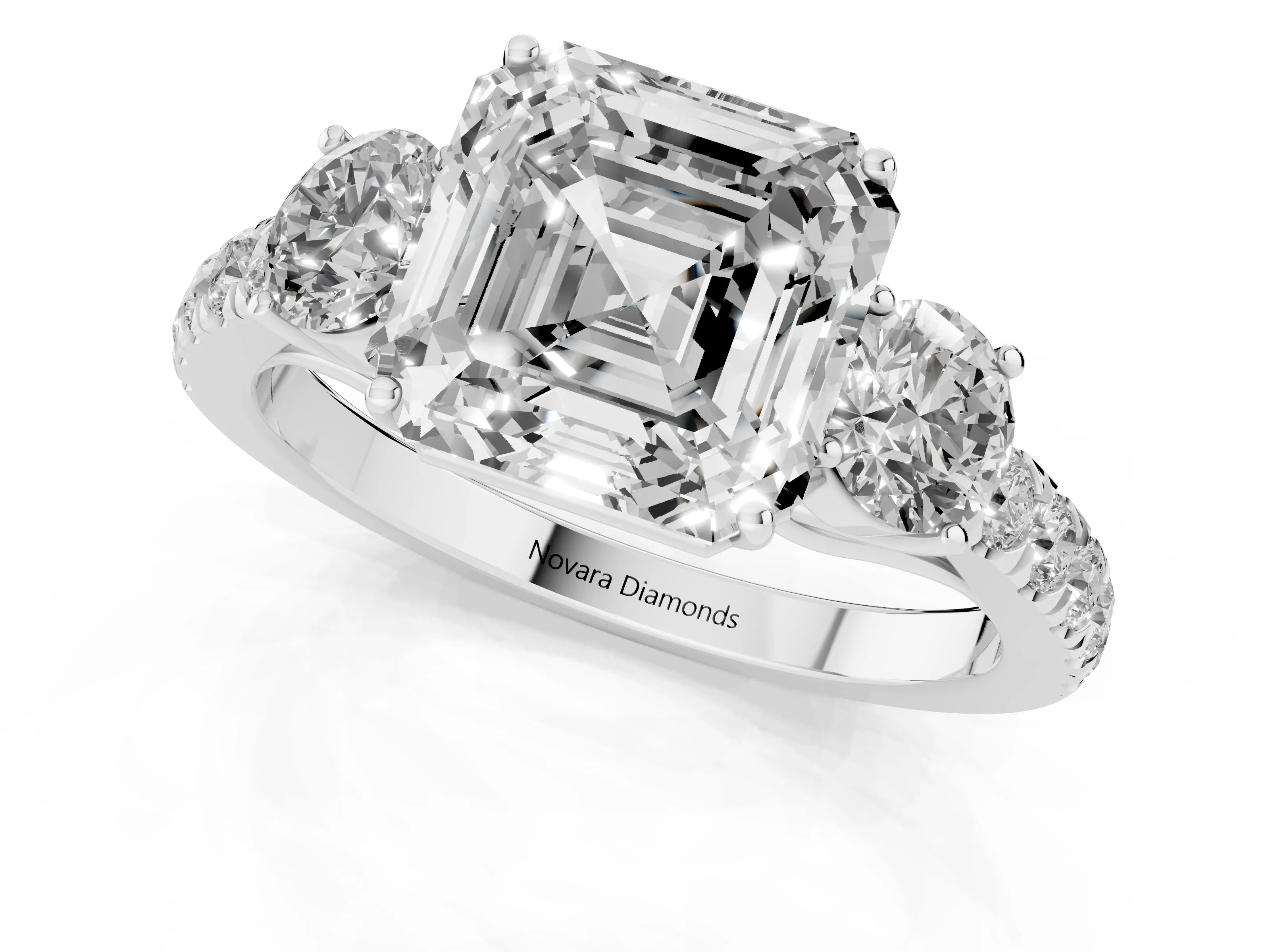 Asscher Cut Diamond Three-Stone Ring Set in White gold with Round Side Stones and Delicate Pavé Band