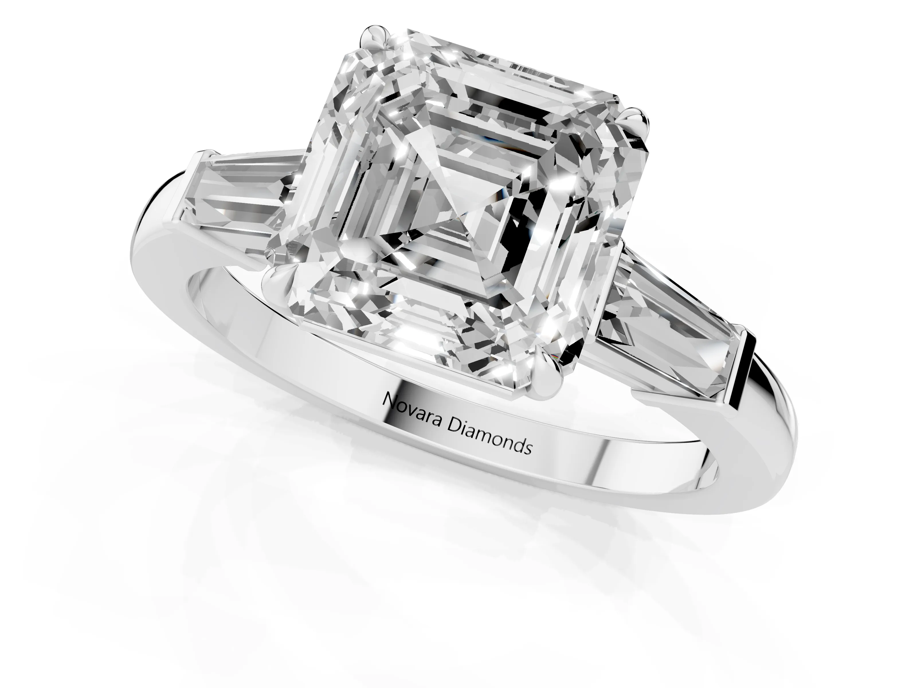 Asscher Cut Diamond Three-Stone Ring Set in White gold with Tapered Baguette Side Stones and Prong Setting
