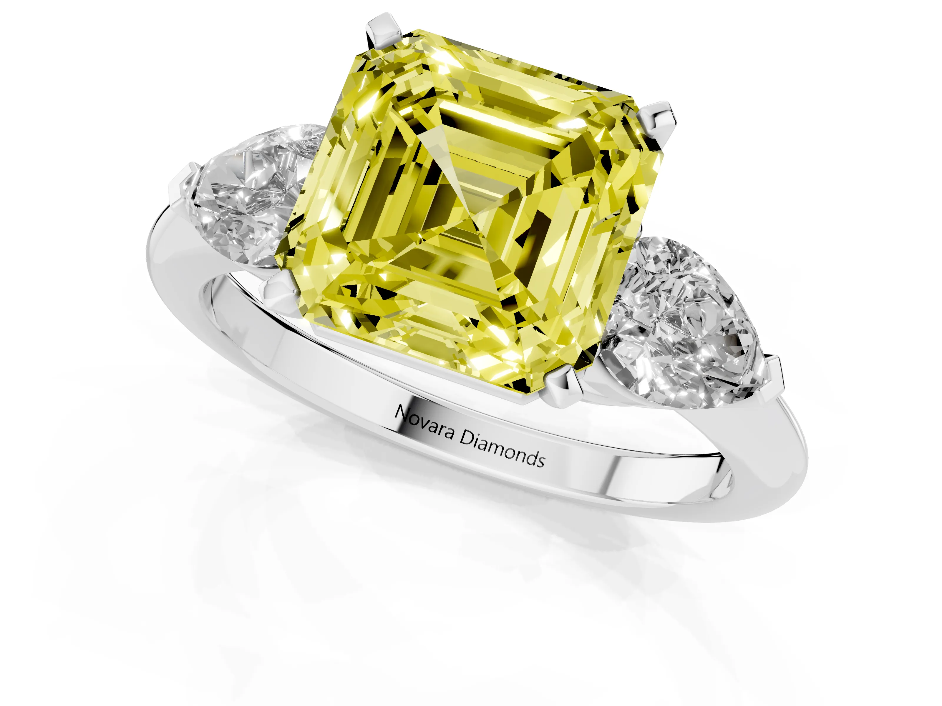 Fancy Yellow Three-Stone Asscher Cut Diamond Ring Set in White gold with Pear Side Stones and Prong Setting