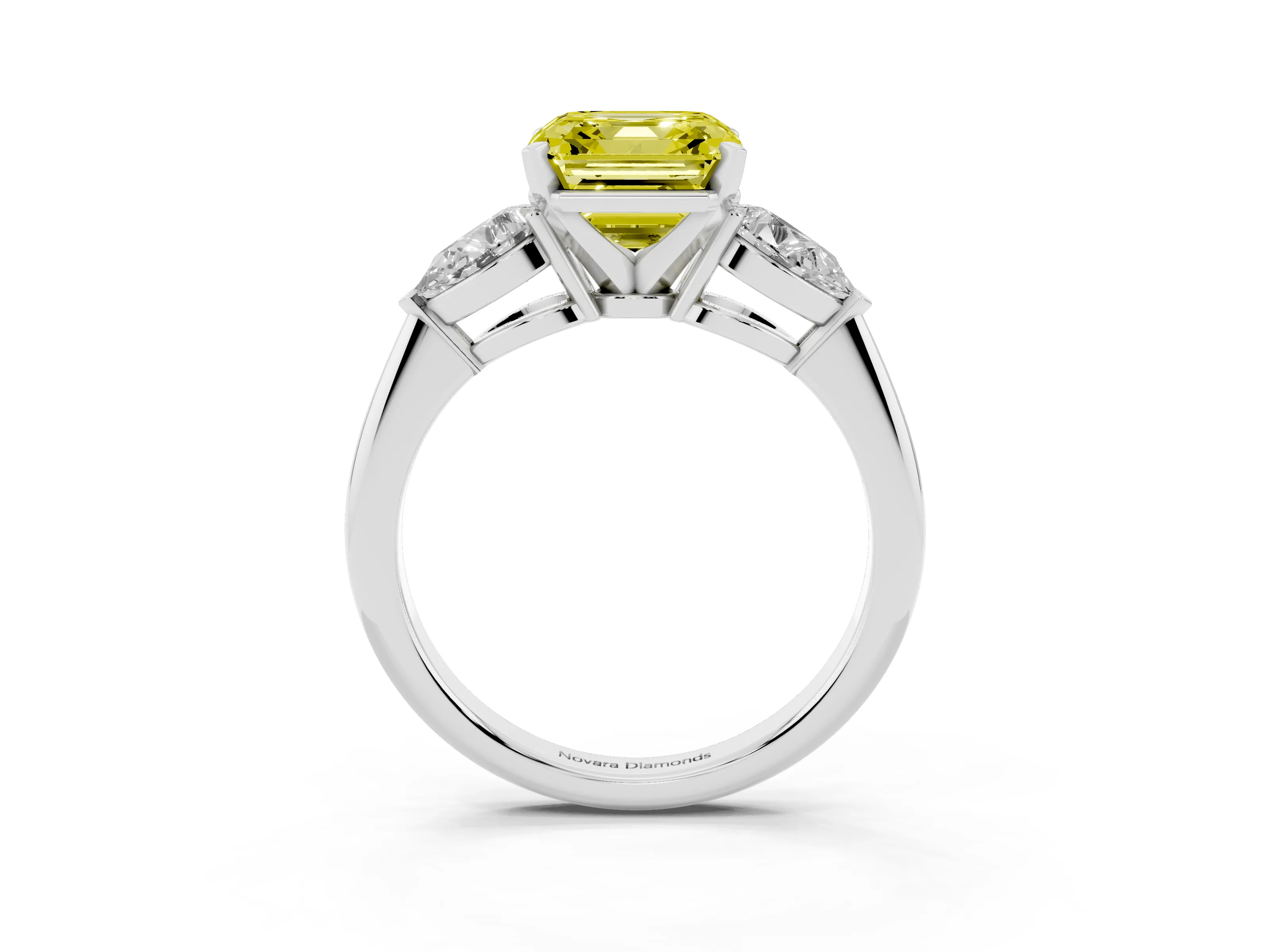 Fancy Yellow Three-Stone Asscher Cut Diamond Ring Set in White gold with Pear Side Stones and Prong Setting