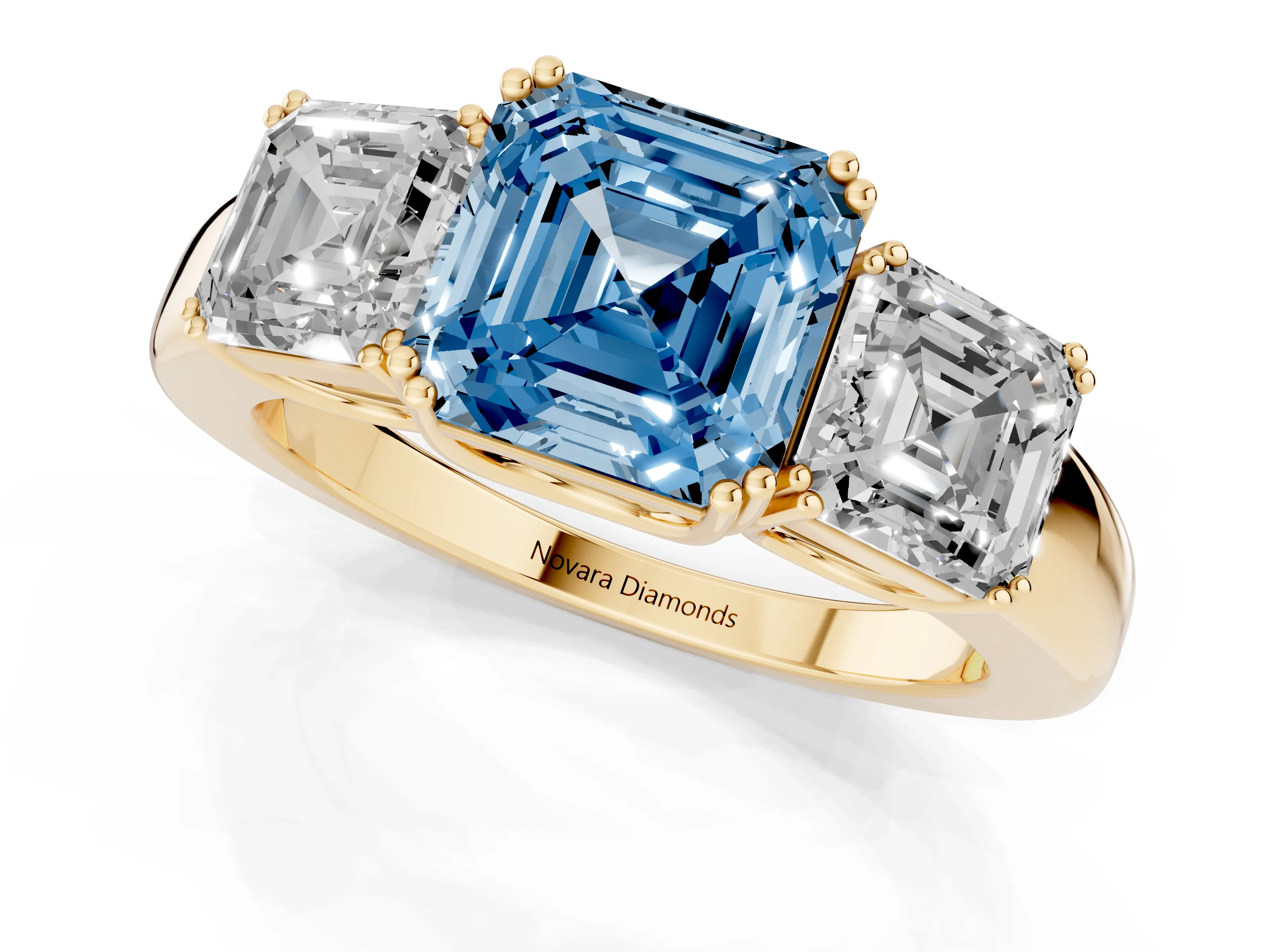 Fancy Blue Asscher Cut Diamond Three-Stone Ring Set in Yellow gold with Polished Band and Prong Setting