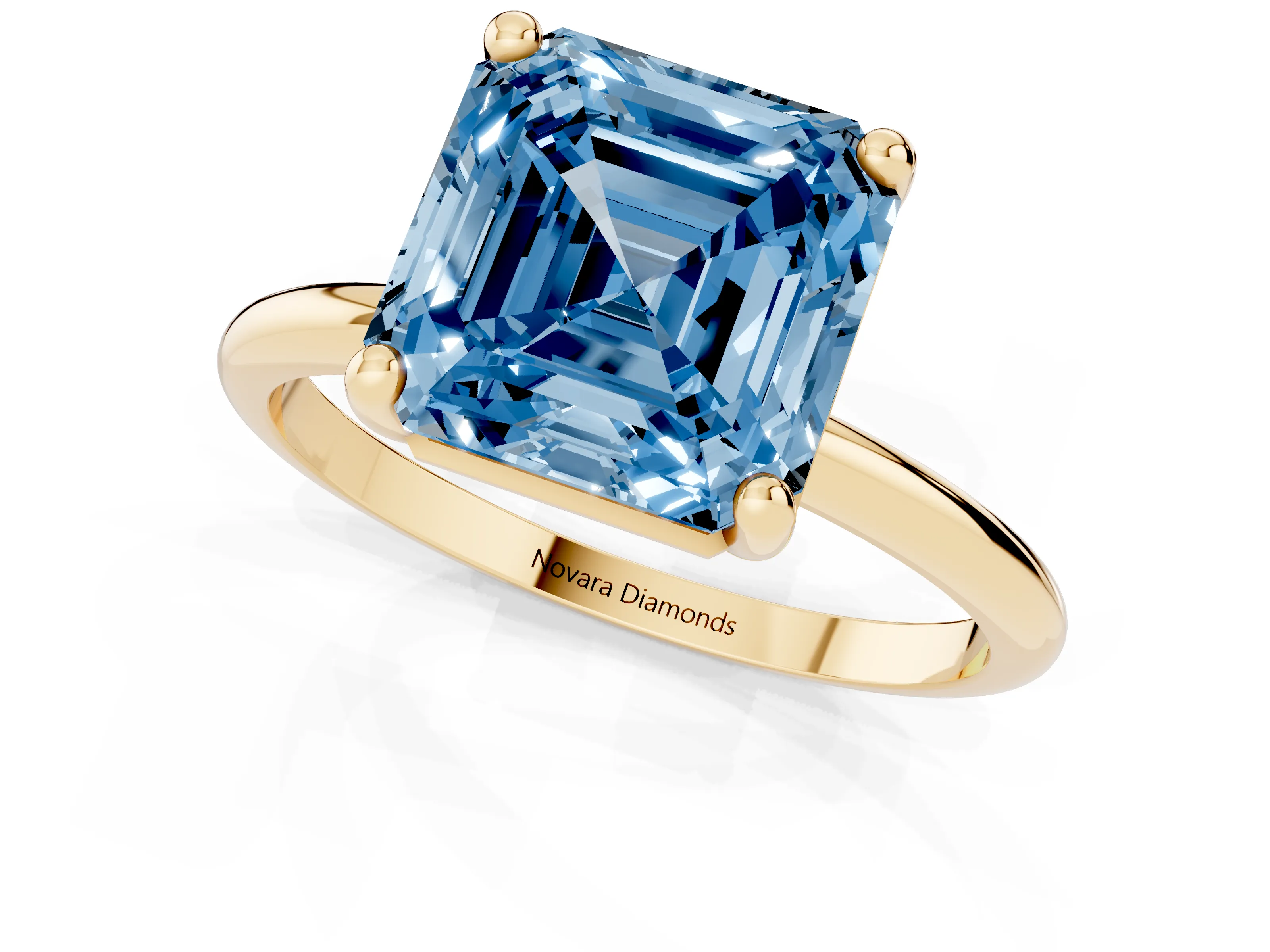 Fancy Blue Asscher Cut Diamond Solitaire Ring Set in Yellow gold with Secure Prong Setting on a Classic Band