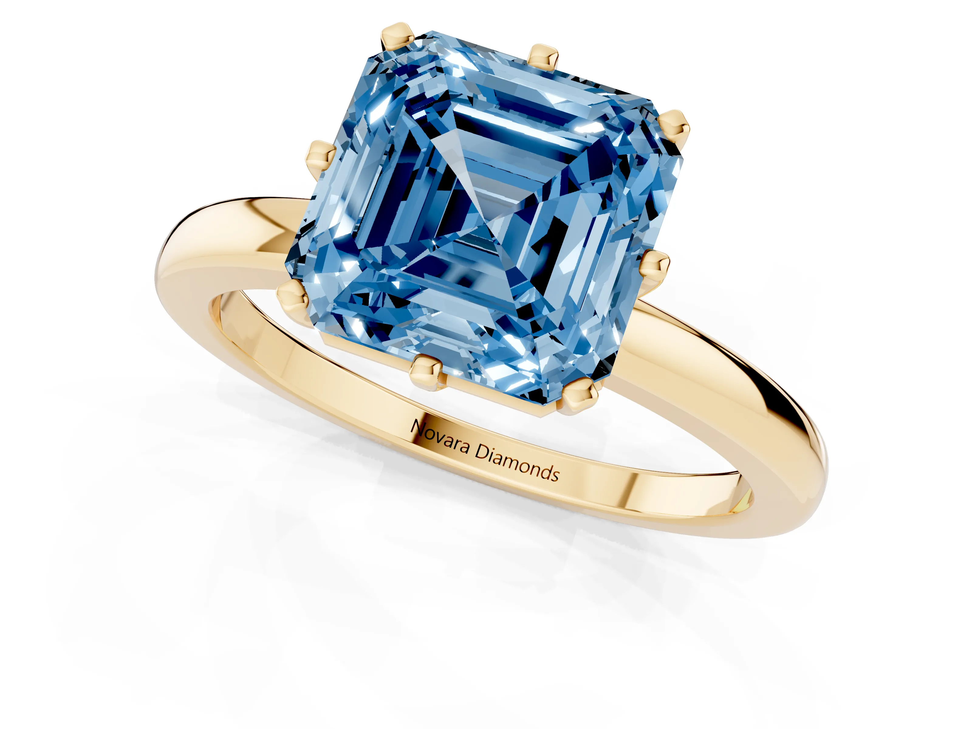 Fancy Blue Asscher Cut Diamond Solitaire Ring Set in Yellow gold with Raised Prong Setting on a Classic Band
