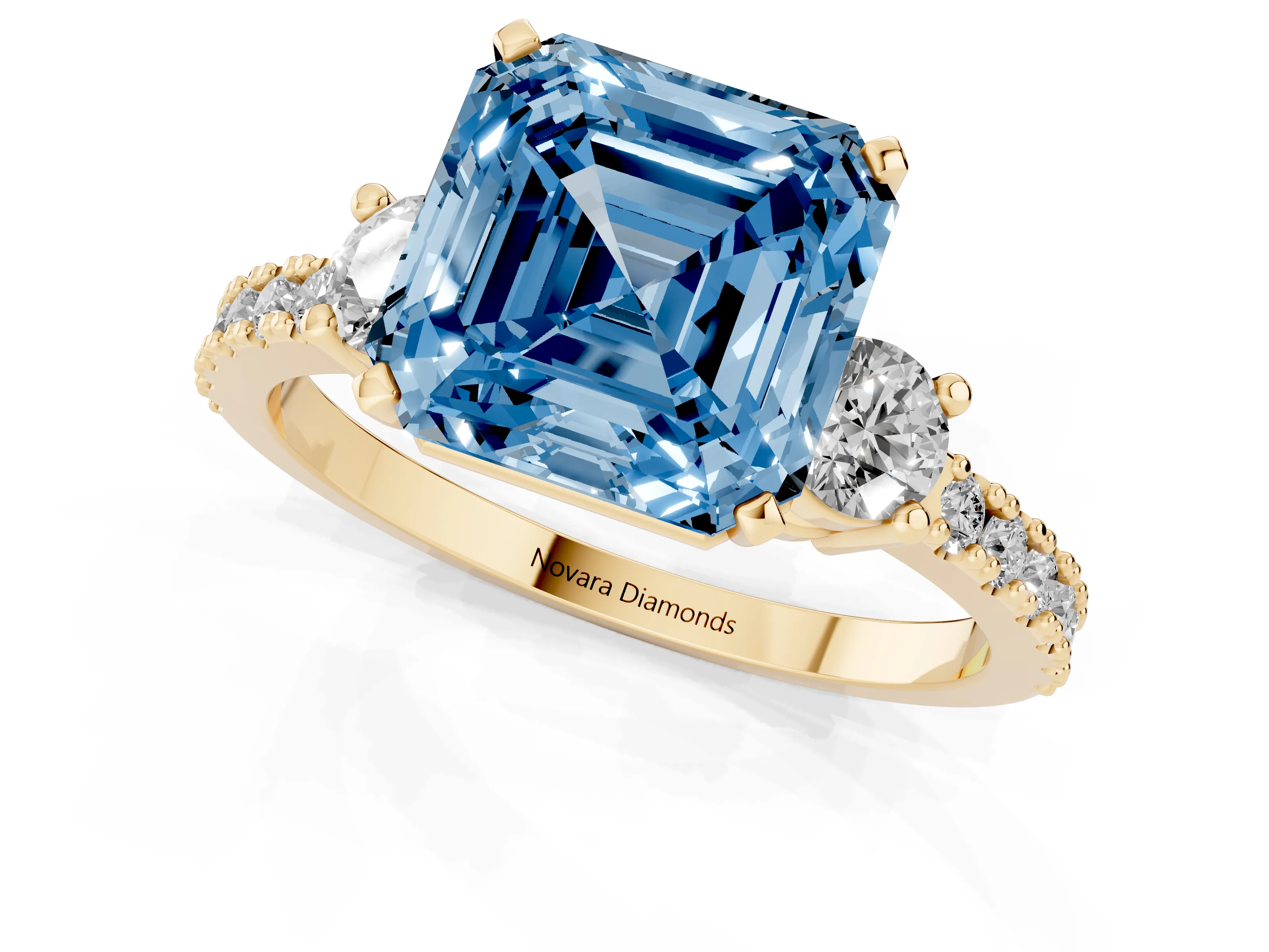 Fancy Blue Three-Stone Asscher Cut Diamond Pavé Band Ring Set in Yellow gold with Prong Setting