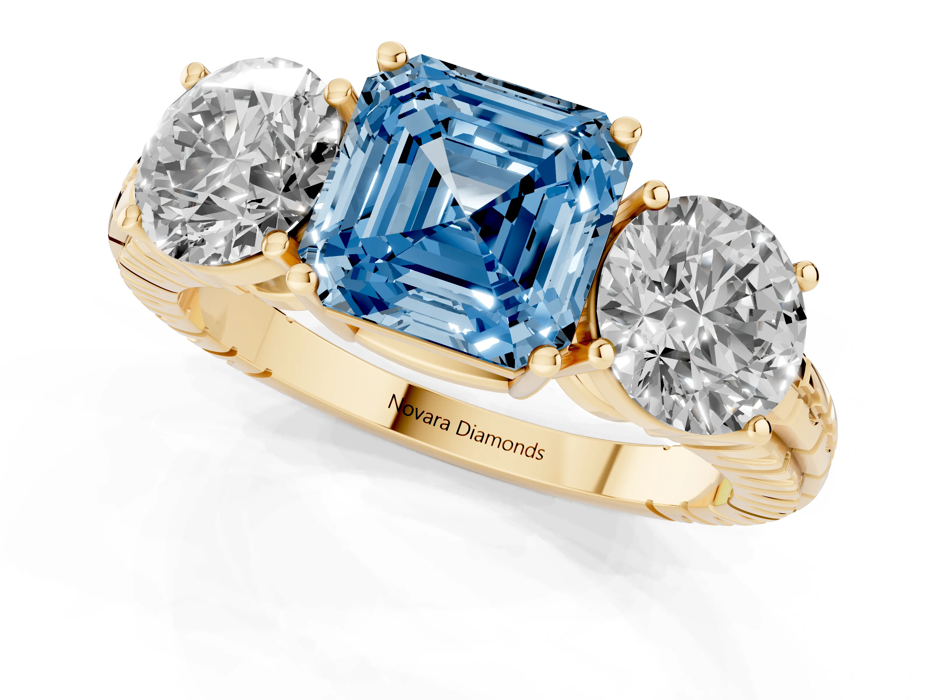 Fancy Blue Asscher Cut Diamond Three-Stone Ring Set in Yellow gold with Channel-Set Accent Band