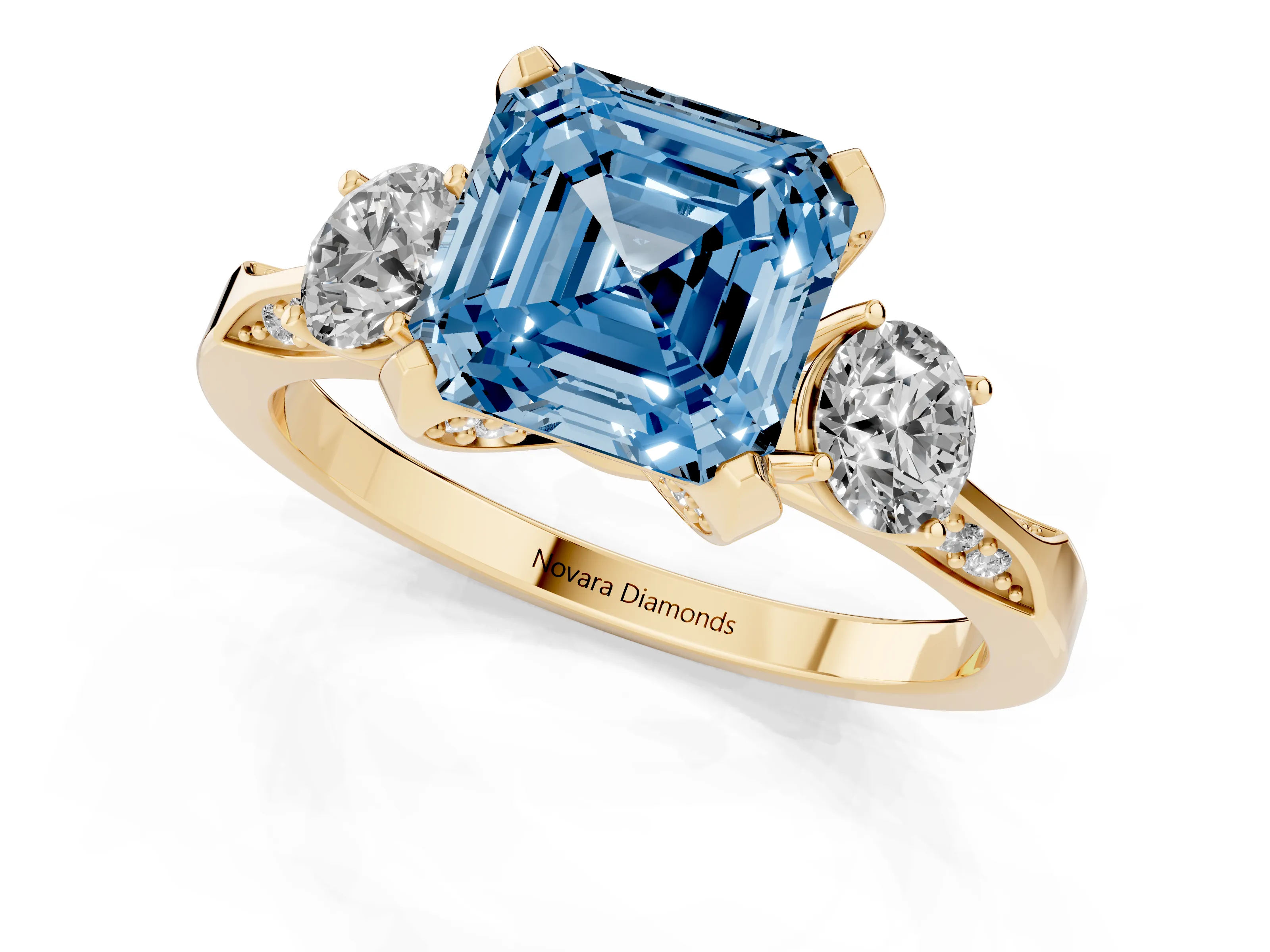 Fancy Blue Asscher Cut Diamond Three-Stone Ring Set in Yellow gold with Pavé Band and Smaller Side Stones