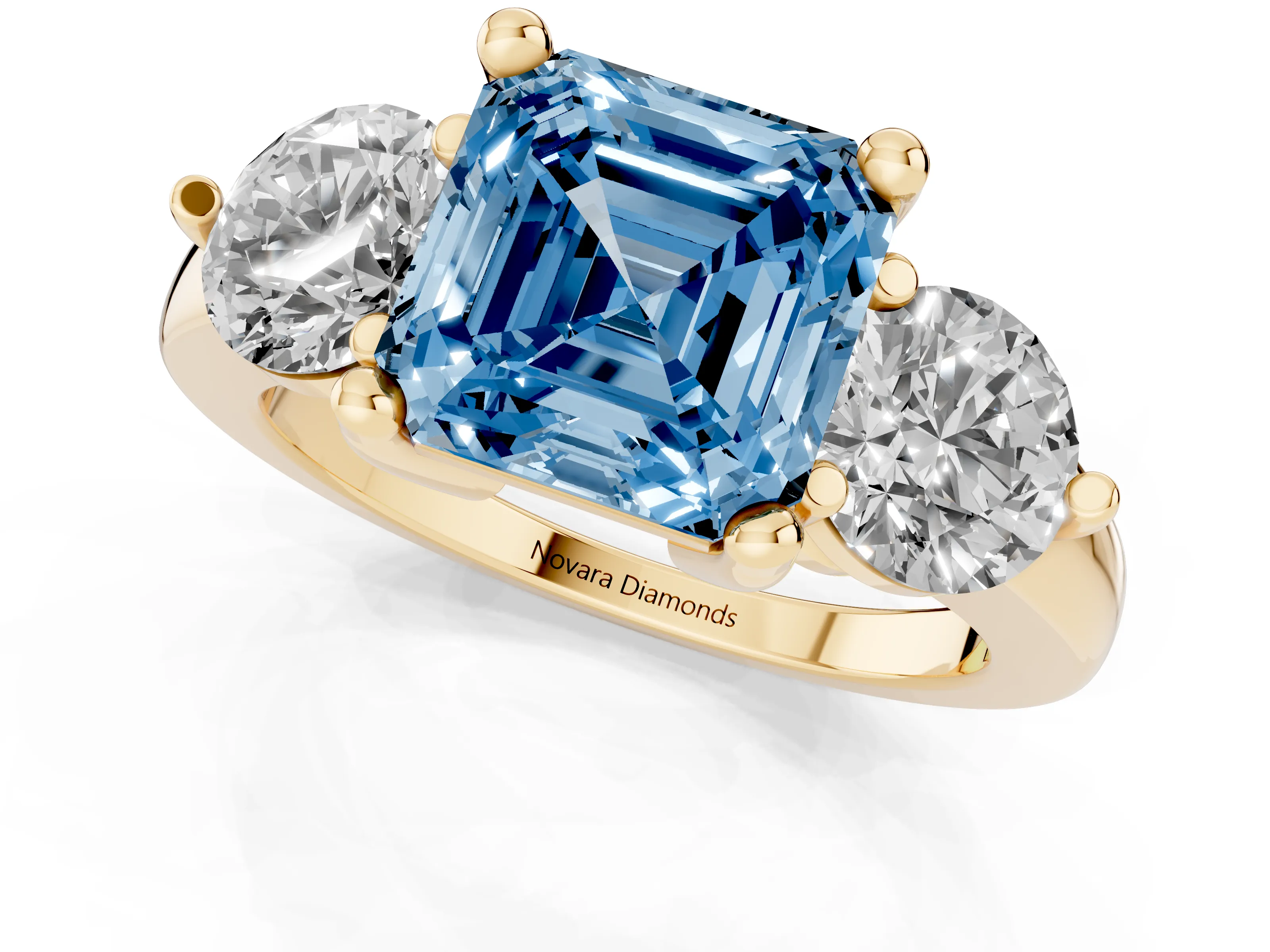 Fancy Blue Asscher Cut Diamond Three-Stone Ring Set in Yellow gold with Prong Setting and Classic Band