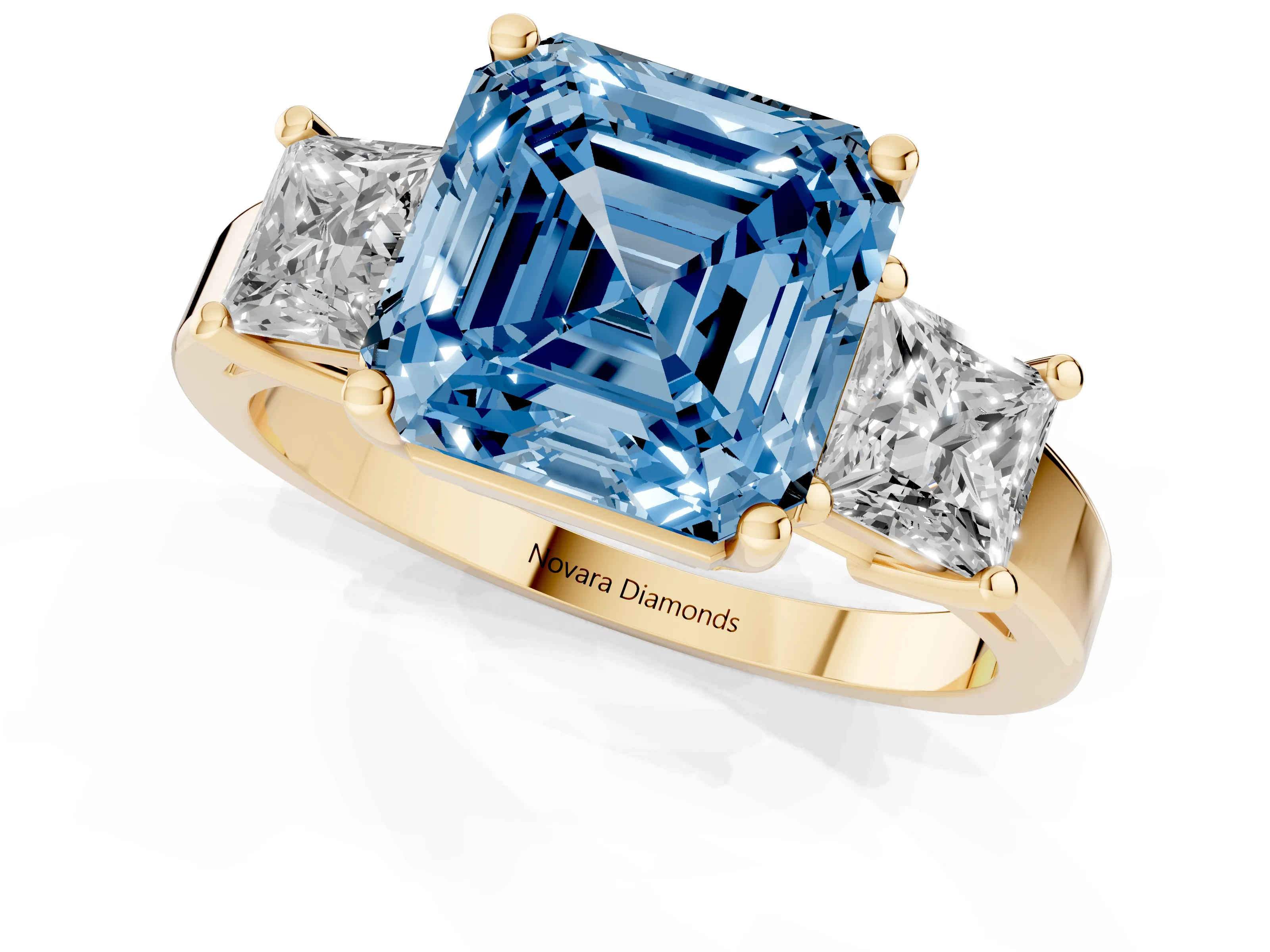 Fancy Blue Three-Stone Asscher Cut Diamond Solitaire Ring Set in Yellow gold with Prong Setting