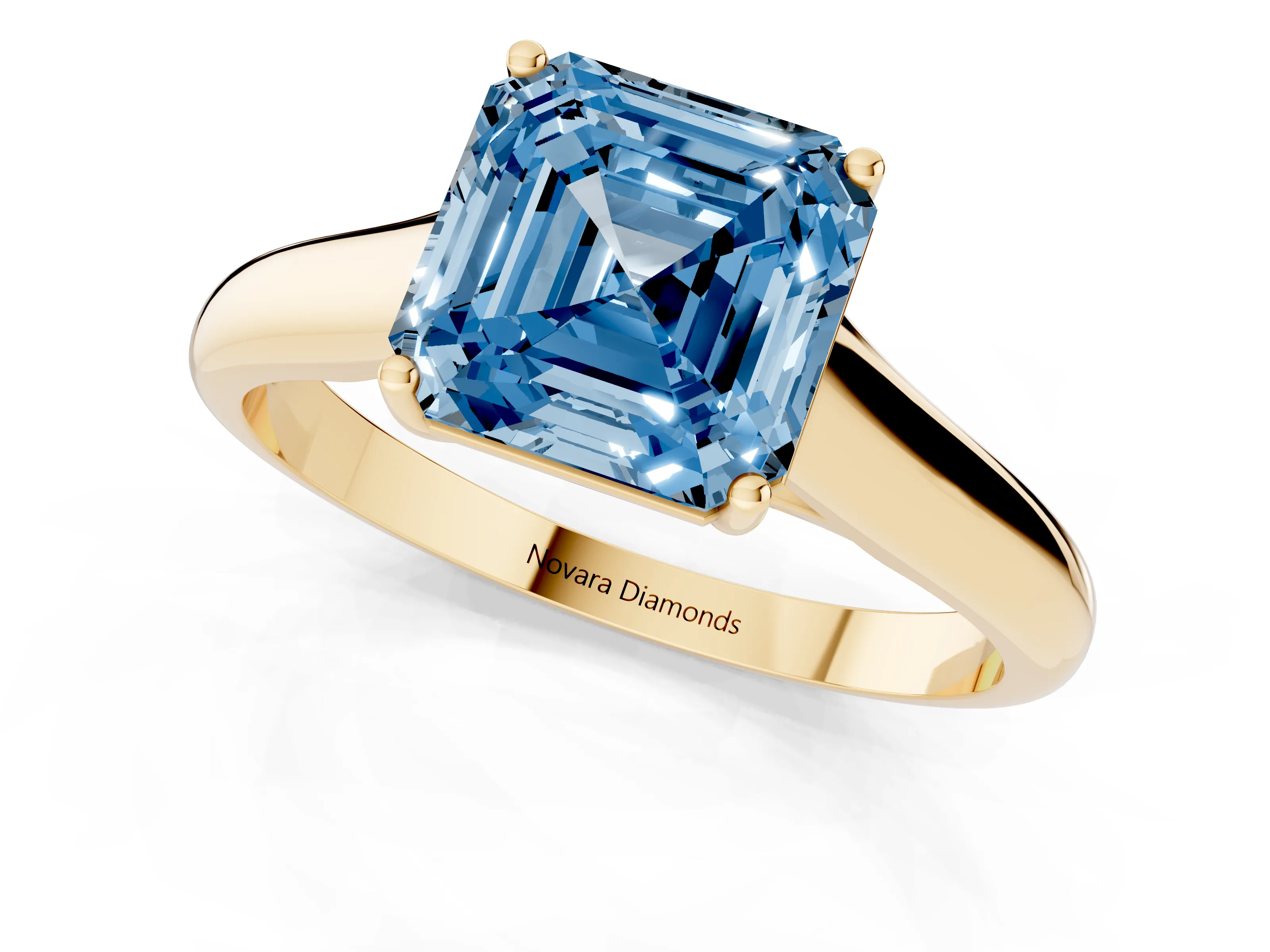 Fancy Blue Asscher Cut Diamond Solitaire Engagement Ring Set in Yellow gold with Subtly Tapered Band and Prong Setting